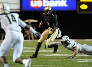 Charleston Southern defenders hone in on a Vanderbilt runner.
