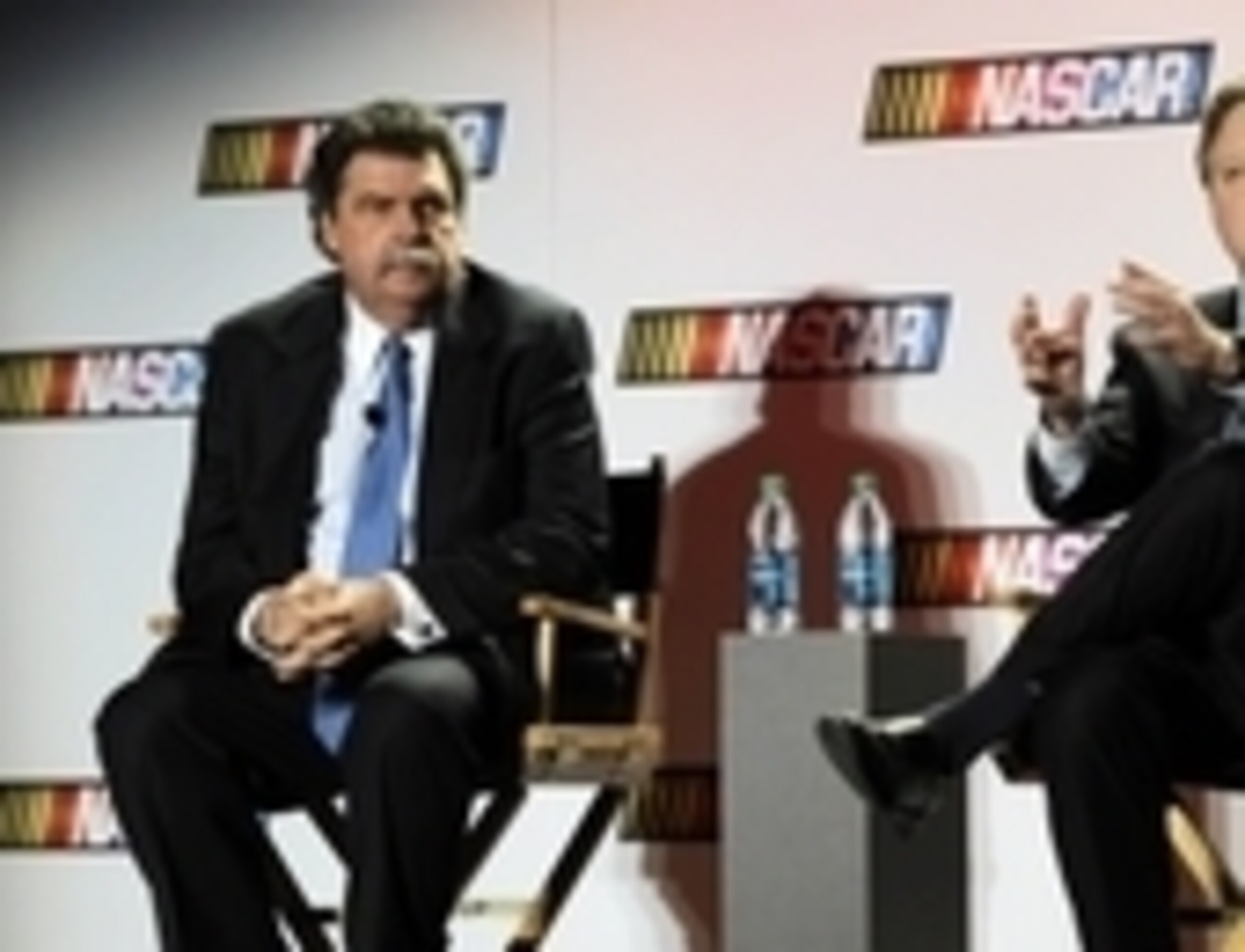 Jan 30, 2014; Charlotte, NC, USA; NASCAR president Mike Helton (left) and NASCAR chief executive officer Brian France (right) address the media on the state of the sport during the Sprint Media Tour at the Charlotte Convention Center. Mandatory Credit: Sa Jan 30, 2014; Charlotte, NC, USA; NASCAR president Mike Helton (left) and NASCAR chief executive officer Brian France (right) address the media on the state of the sport during the Sprint Media Tour at the Charlotte Convention Center. Mandatory Credit: Sa