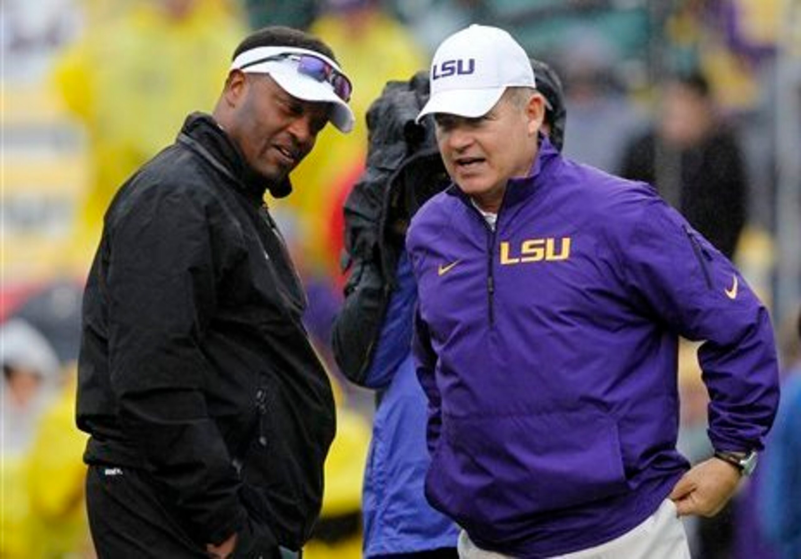 Texas A&M head coach Kevin Sumlin (left) and LSU head coach Les Miles (right)