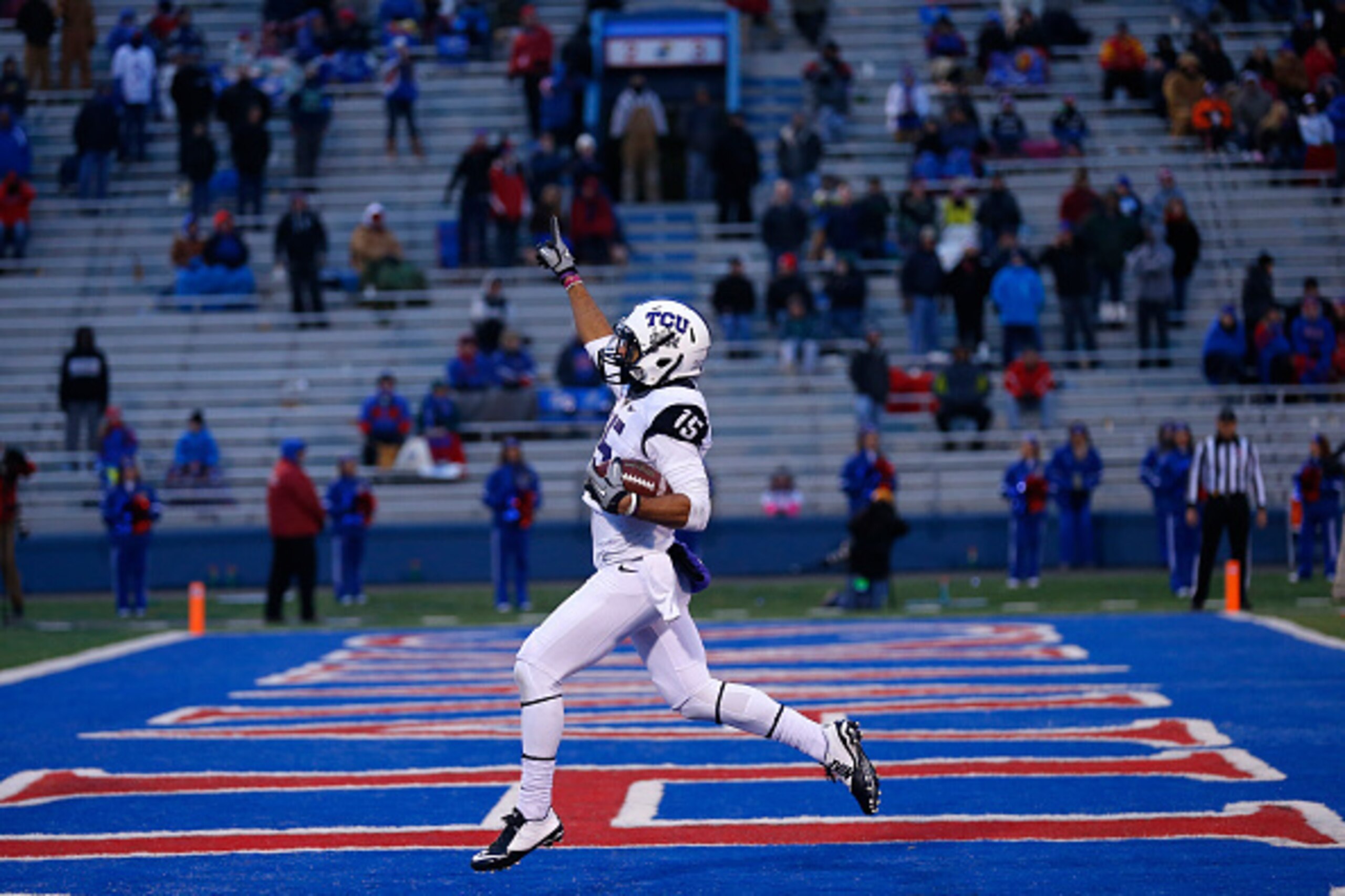 LAWRENCE, KS - NOVEMBER 15: Cameron Echols-Luper #15 of the TCU Horned Frogs celebrates his 69-yard punt return for a touchdown in the third quarter during a game against the Kansas Jayhawks at Memorial Stadium on November 15, 2014 in Lawrence, Kansas. T LAWRENCE, KS - NOVEMBER 15: Cameron Echols-Luper #15 of the TCU Horned Frogs celebrates his 69-yard punt return for a touchdown in the third quarter during a game against the Kansas Jayhawks at Memorial Stadium on November 15, 2014 in Lawrence, Kansas. T