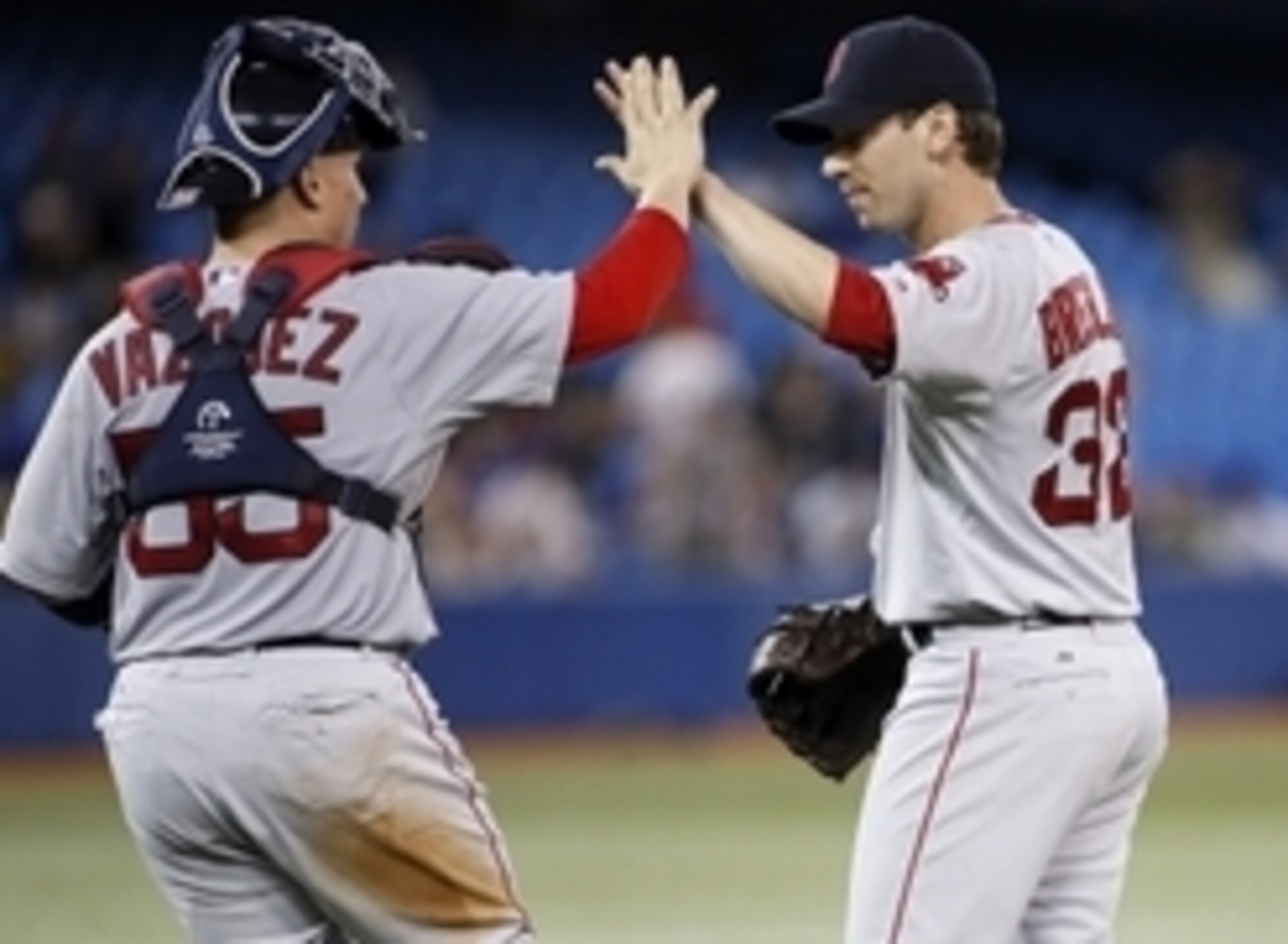 Aug 25, 2014; Toronto, Ontario, CAN; Boston Red Sox pitcher Craig Breslow (32) and catcher Christian Vazquez (55) celebrate a win over the Toronto Blue Jays at Rogers Centre. Boston defeated Toronto 4-3 in 10 innings. Mandatory Credit: John E. Sokolowski- Aug 25, 2014; Toronto, Ontario, CAN; Boston Red Sox pitcher Craig Breslow (32) and catcher Christian Vazquez (55) celebrate a win over the Toronto Blue Jays at Rogers Centre. Boston defeated Toronto 4-3 in 10 innings. Mandatory Credit: John E. Sokolowski-