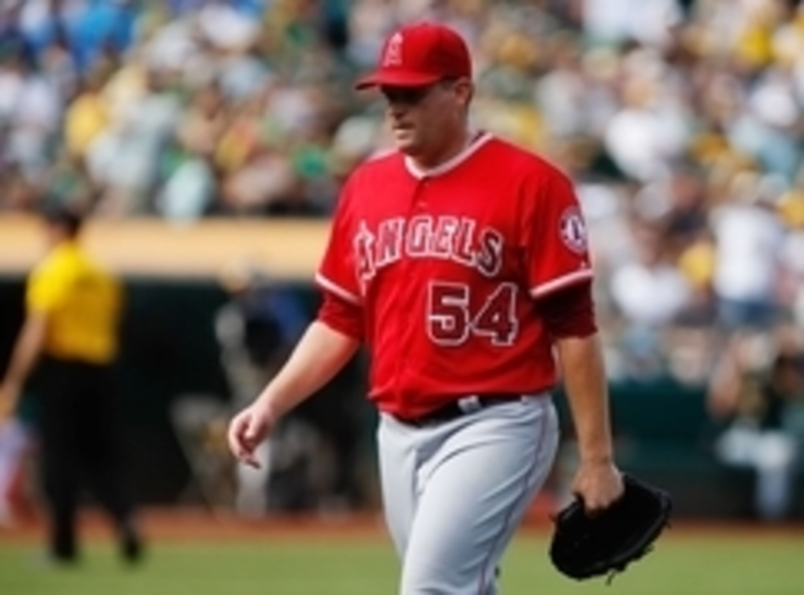 Sep 24, 2014; Oakland, CA, USA; Los Angeles Angels relief pitcher Joe Thatcher (54) returns to the dugout against the Oakland Athletics during the seventh inning at O.co Coliseum. Mandatory Credit: Kelley L Cox-USA TODAY Sports Sep 24, 2014; Oakland, CA, USA; Los Angeles Angels relief pitcher Joe Thatcher (54) returns to the dugout against the Oakland Athletics during the seventh inning at O.co Coliseum. Mandatory Credit: Kelley L Cox-USA TODAY Sports
