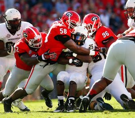 A host of Georgia defenders swarm a Vanderbilt runner.