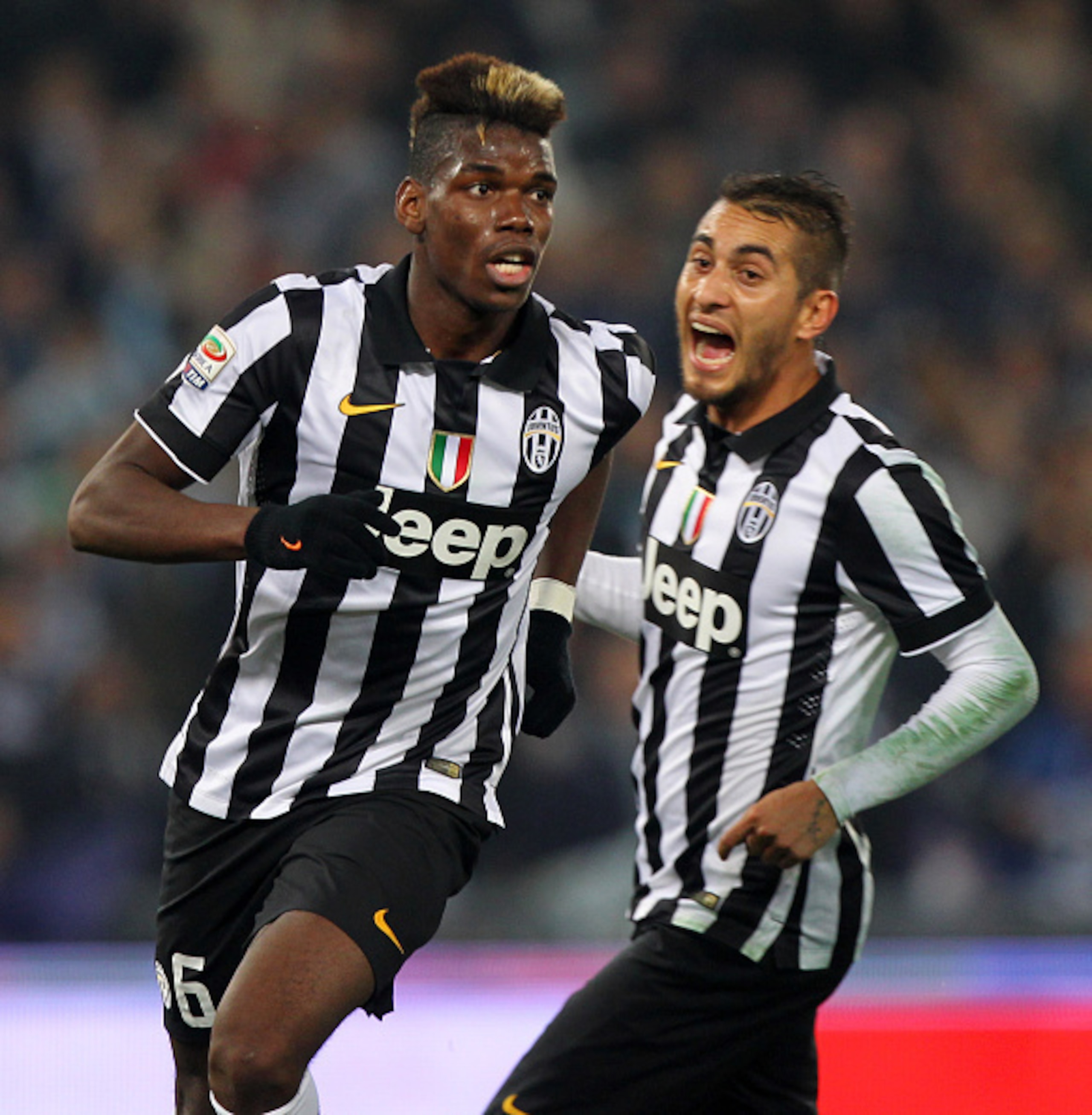 ROME, ITALY - NOVEMBER 22:  Paul Pogba with his teammate Roberto Pereyra of Juventus FC celebrates after scoring the opening goal during the Serie A match between SS Lazio and Juventus FC at Stadio Olimpico on November 22, 2014 in Rome, Italy.  (Photo by 