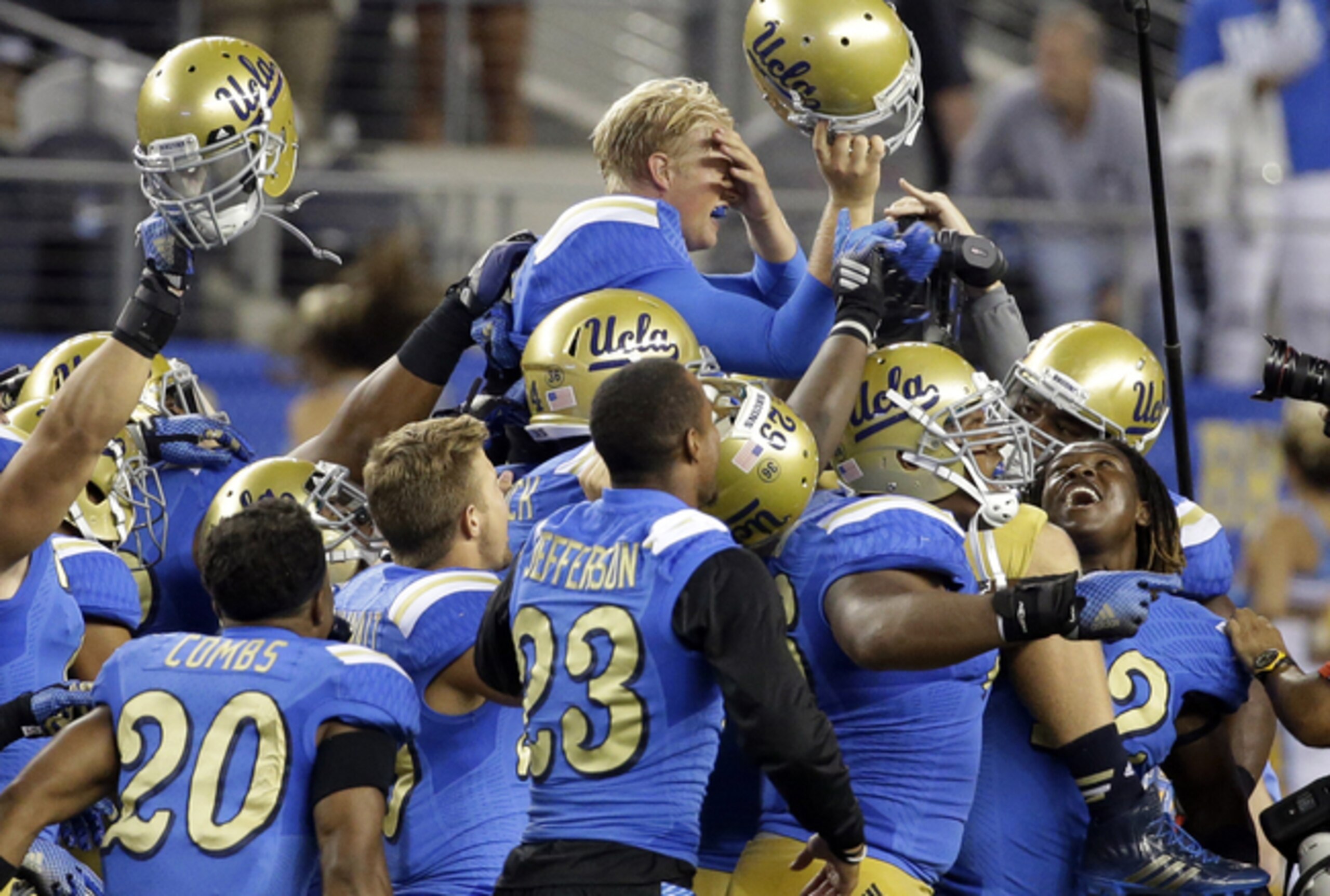 Neuheisel celebrating with his teammates...