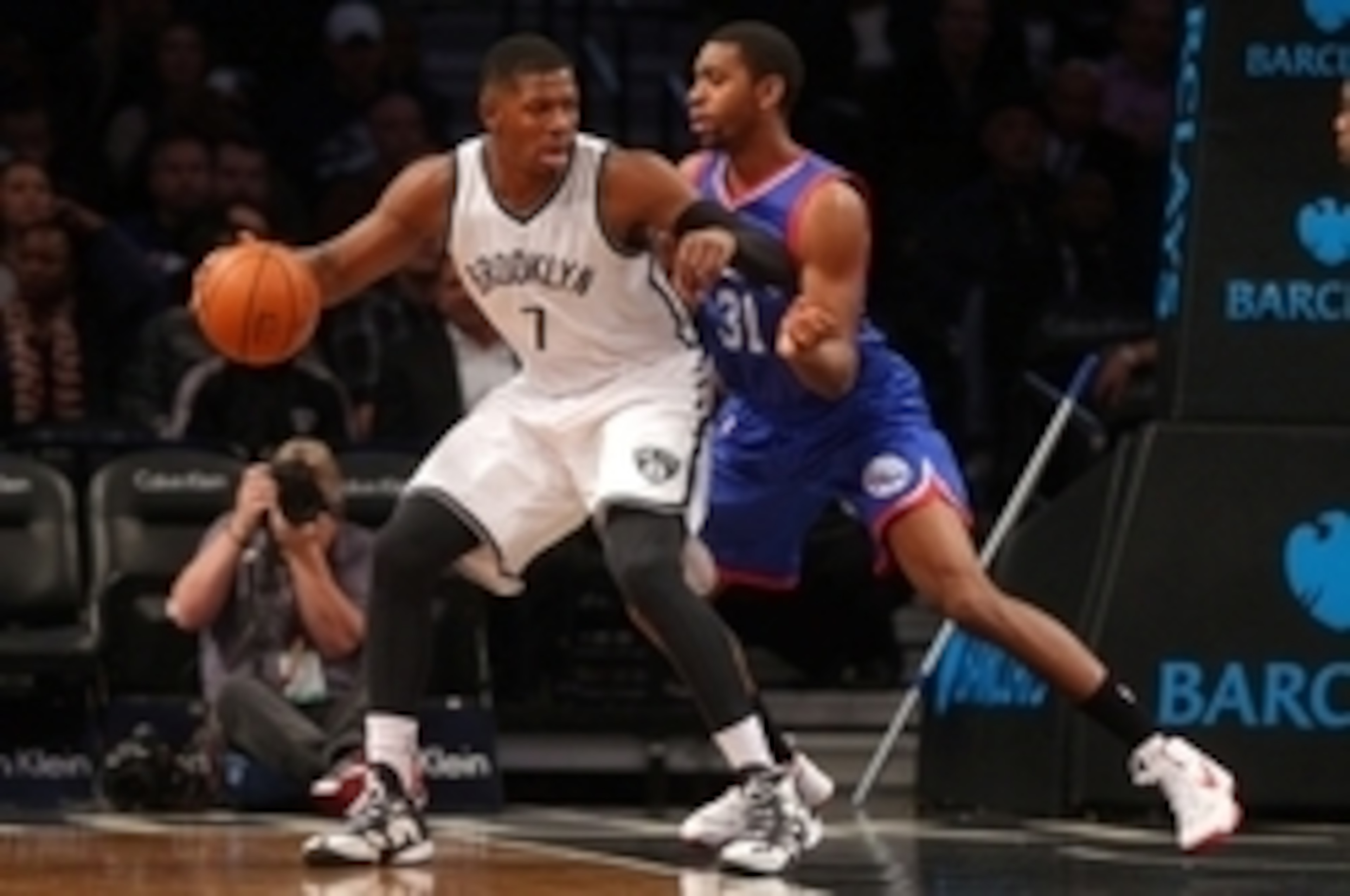 Oct 20, 2014; Brooklyn, NY, USA; Brooklyn Nets shooting guard Joe Johnson (7) controls the ball in front of Philadelphia 76ers shooting guard Hollis Thompson (31) during the first quarter at Barclays Center. Mandatory Credit: Brad Penner-USA TODAY Sports Oct 20, 2014; Brooklyn, NY, USA; Brooklyn Nets shooting guard Joe Johnson (7) controls the ball in front of Philadelphia 76ers shooting guard Hollis Thompson (31) during the first quarter at Barclays Center. Mandatory Credit: Brad Penner-USA TODAY Sports