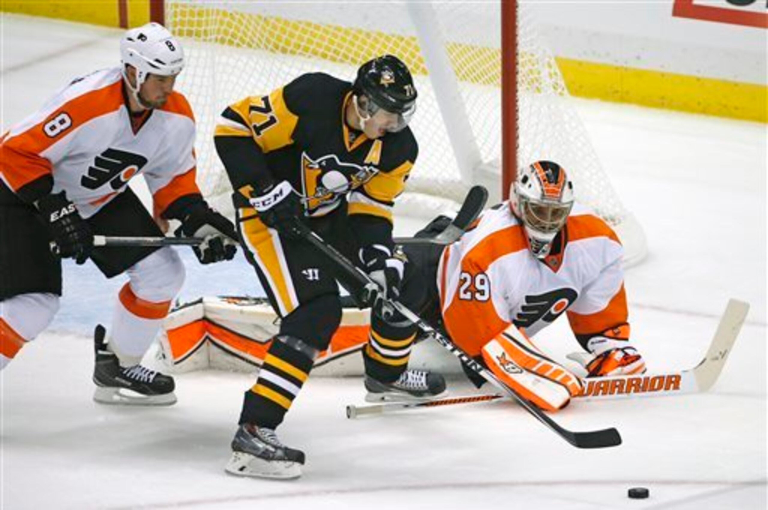 Evgeni Malkin shoots on Ray Emery