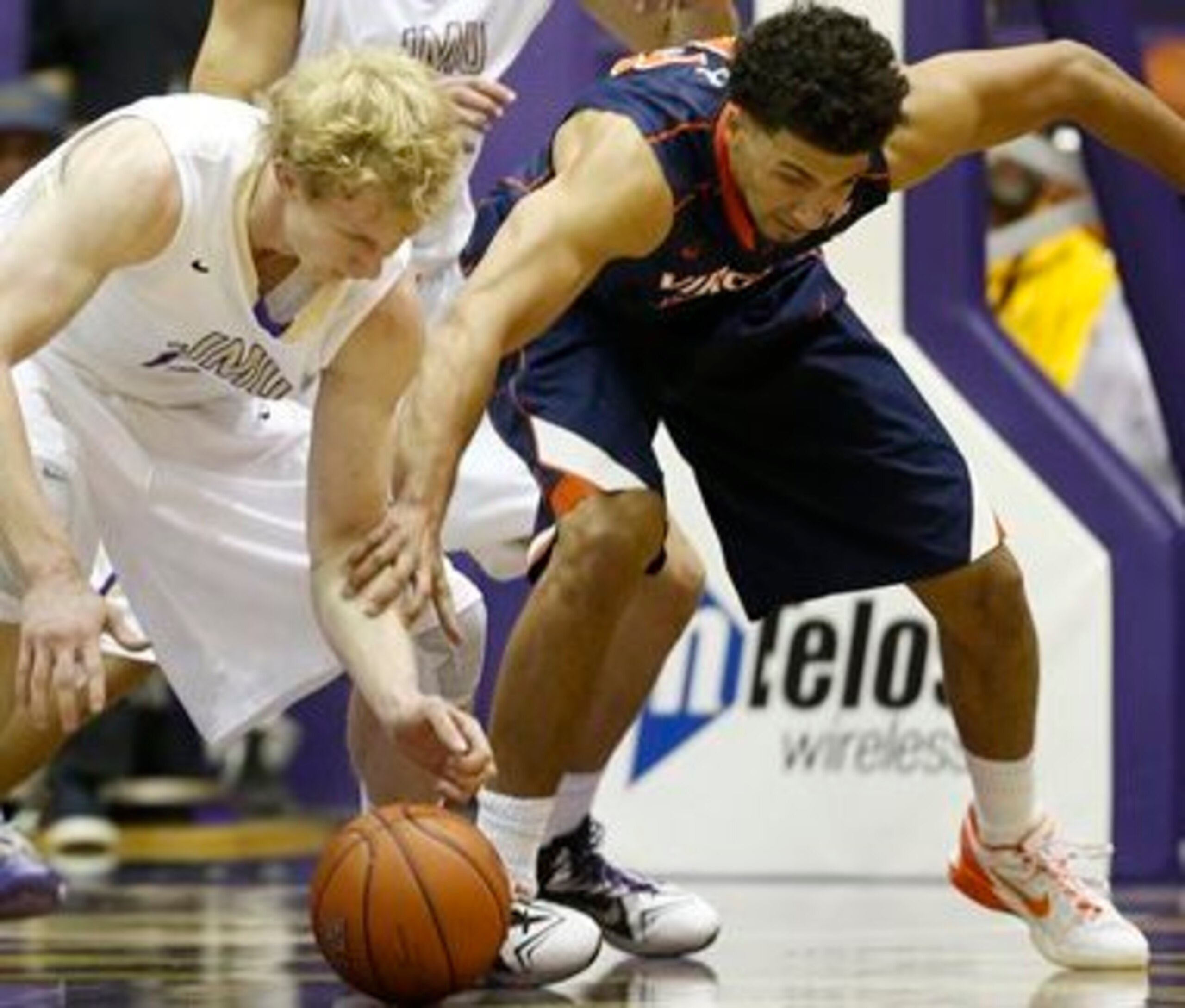 Virginia forward Anthony Gill battling for a loose ball