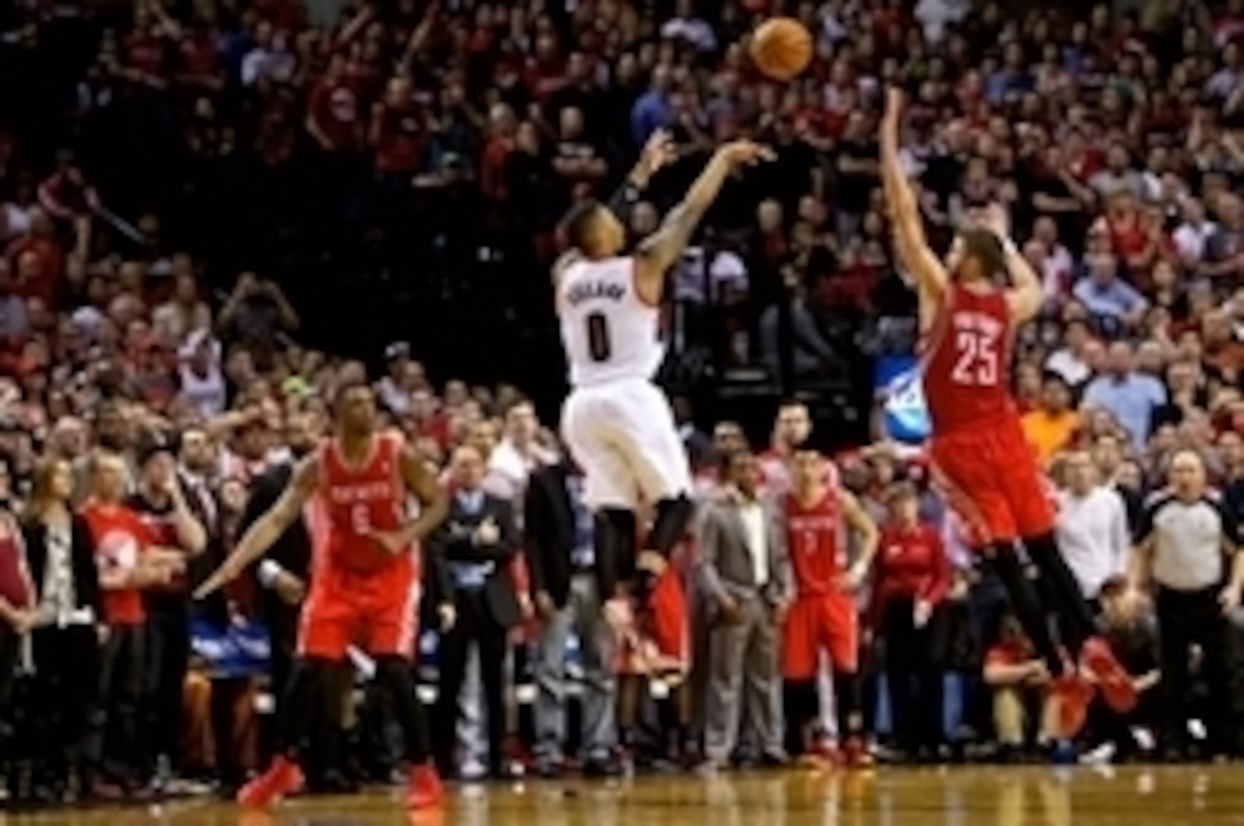 May 2, 2014; Portland, OR, USA; Portland Trail Blazers guard Damian Lillard (0) makes a three pointer at the buzzer over Houston Rockets forward Chandler Parsons (25) to win the game during the fourth quarter in game six of the first round of the 2014 NBA