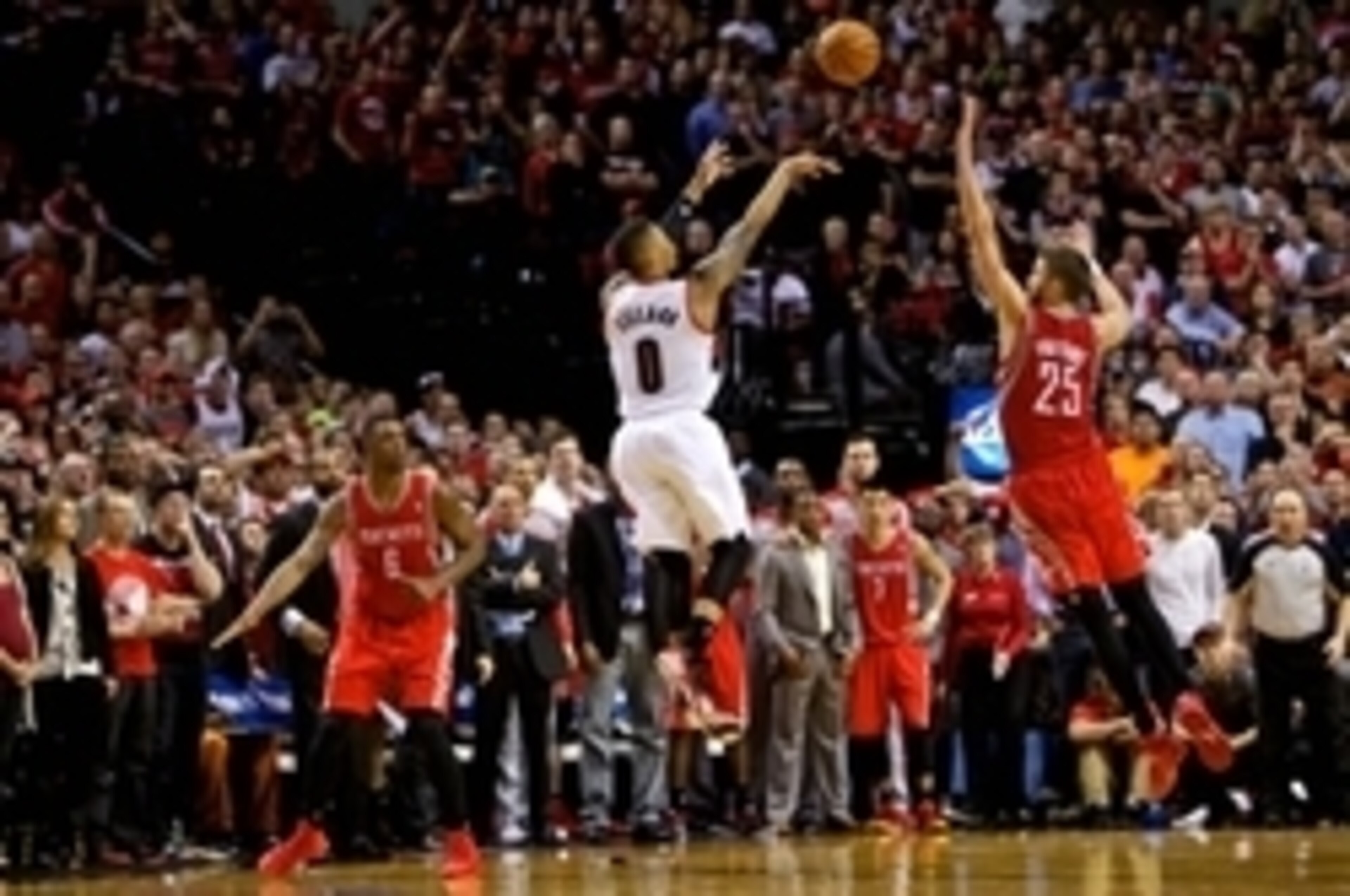 May 2, 2014; Portland, OR, USA; Portland Trail Blazers guard Damian Lillard (0) makes a three pointer at the buzzer over Houston Rockets forward Chandler Parsons (25) to win the game during the fourth quarter in game six of the first round of the 2014 NBA