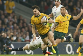 Adam Ashley-Cooper runs a good line, as Mike Brown tries to hold on.