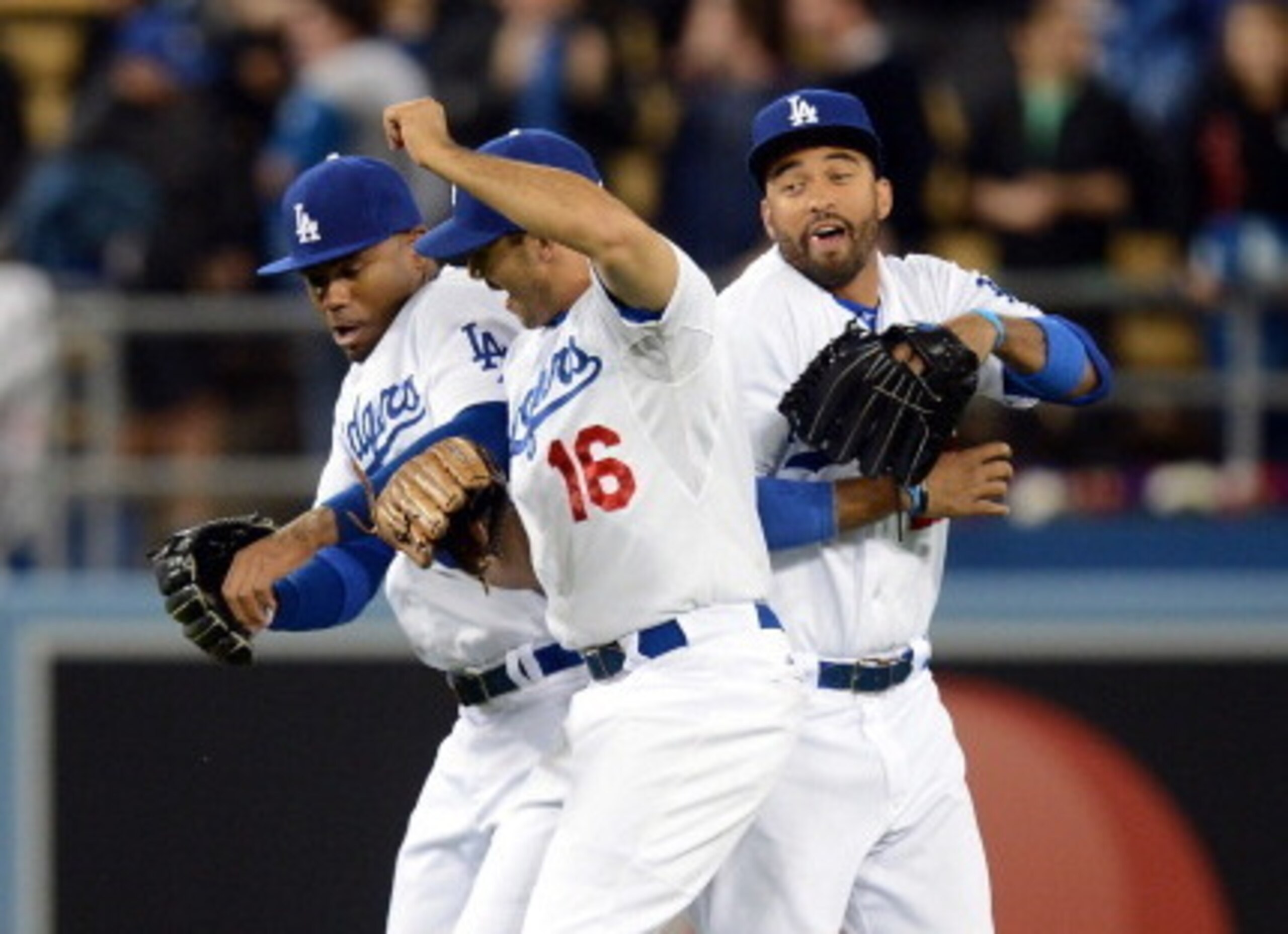 The Dodgers are aggressively trying to trade one of their high-priced outfielders, according to reports.