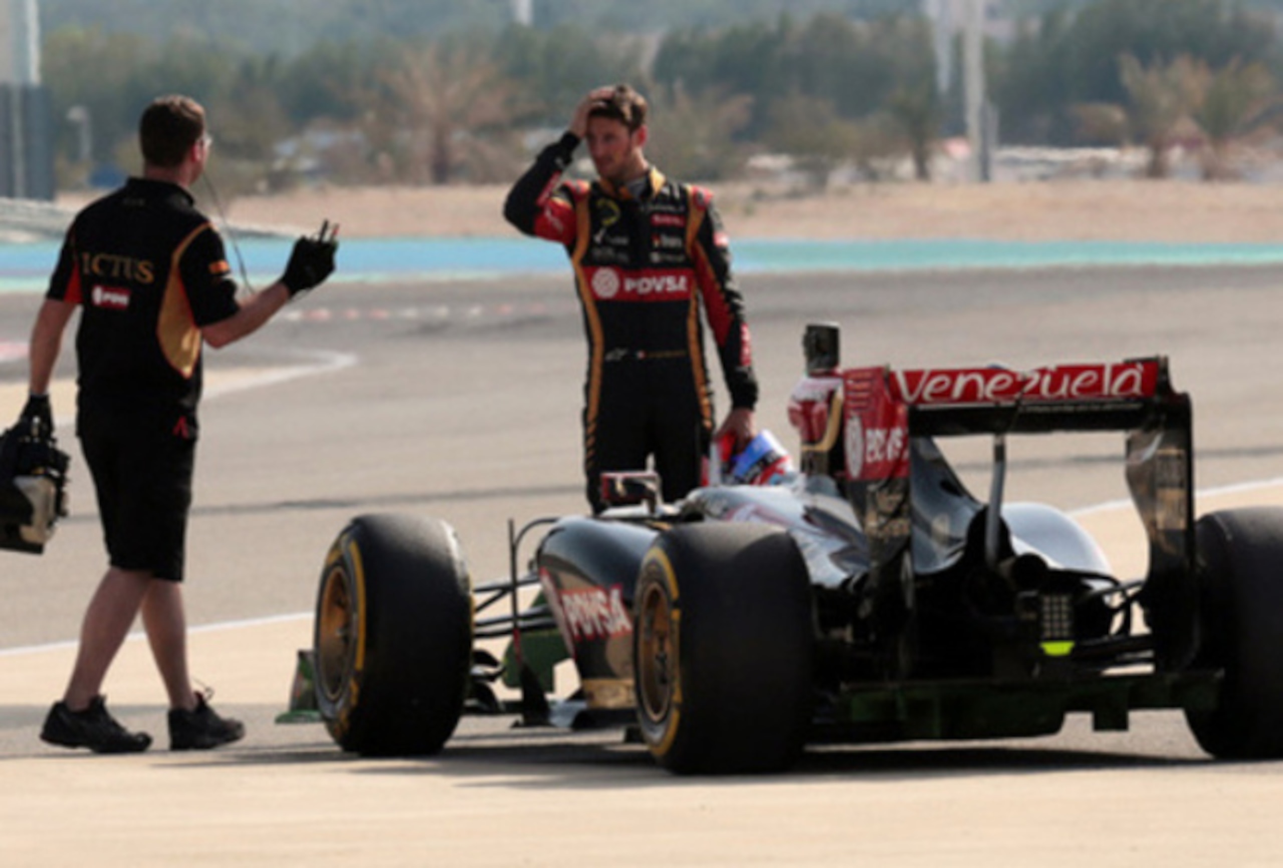 A sign of things to come: Grosjean's car breaks down during preseason testing in Bahrain.
