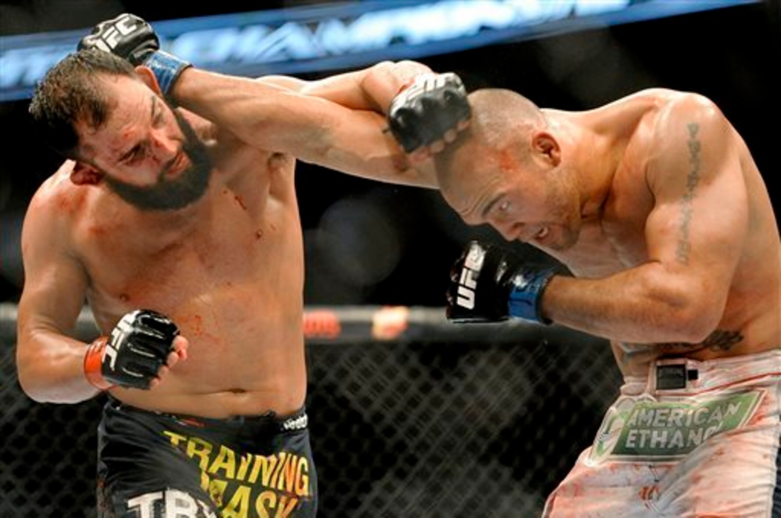 Johny Hendricks (left) and Robbie Lawler in their first fight in March.