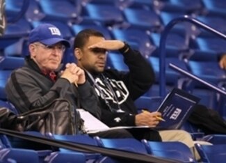 Marc Ross (right) sits with head coach Tom Coughlin at last year's NFL combine.