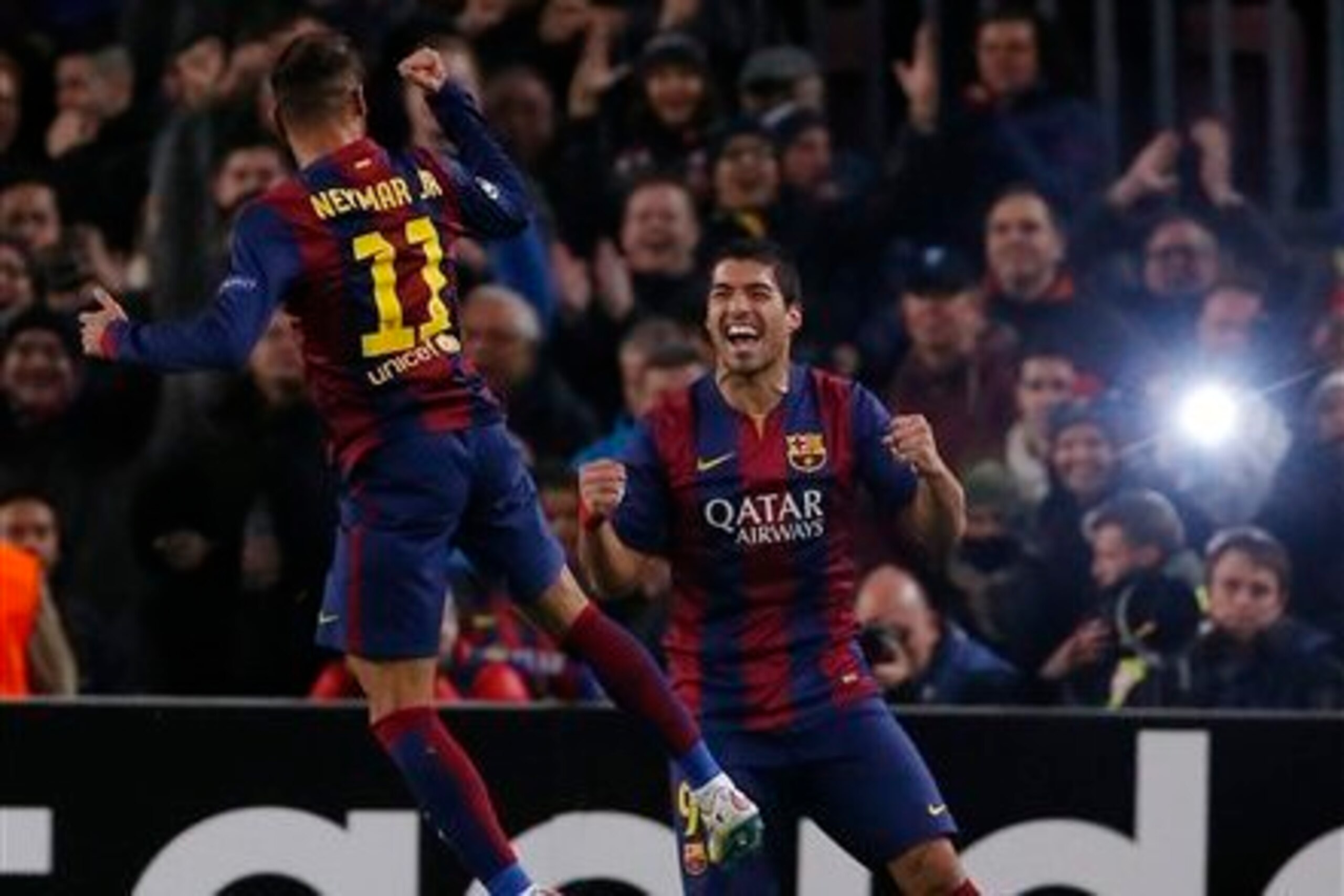 Neymar and Luis Suarez celebrate.