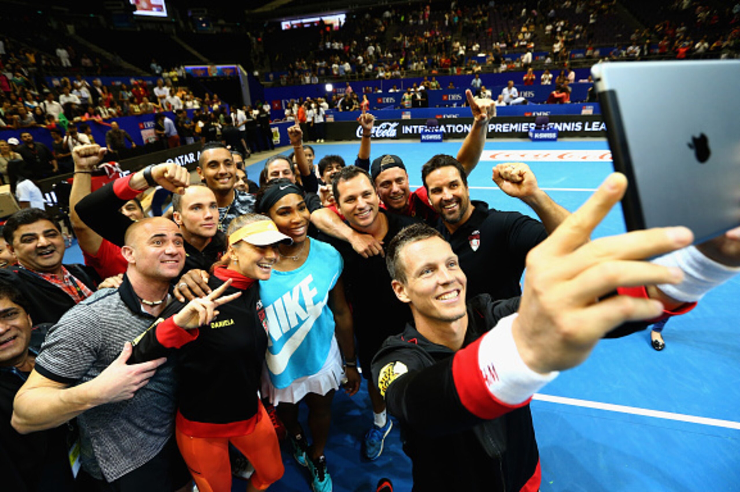 Tomas Berdych takes a selfie with Singapore Slammers teammates.