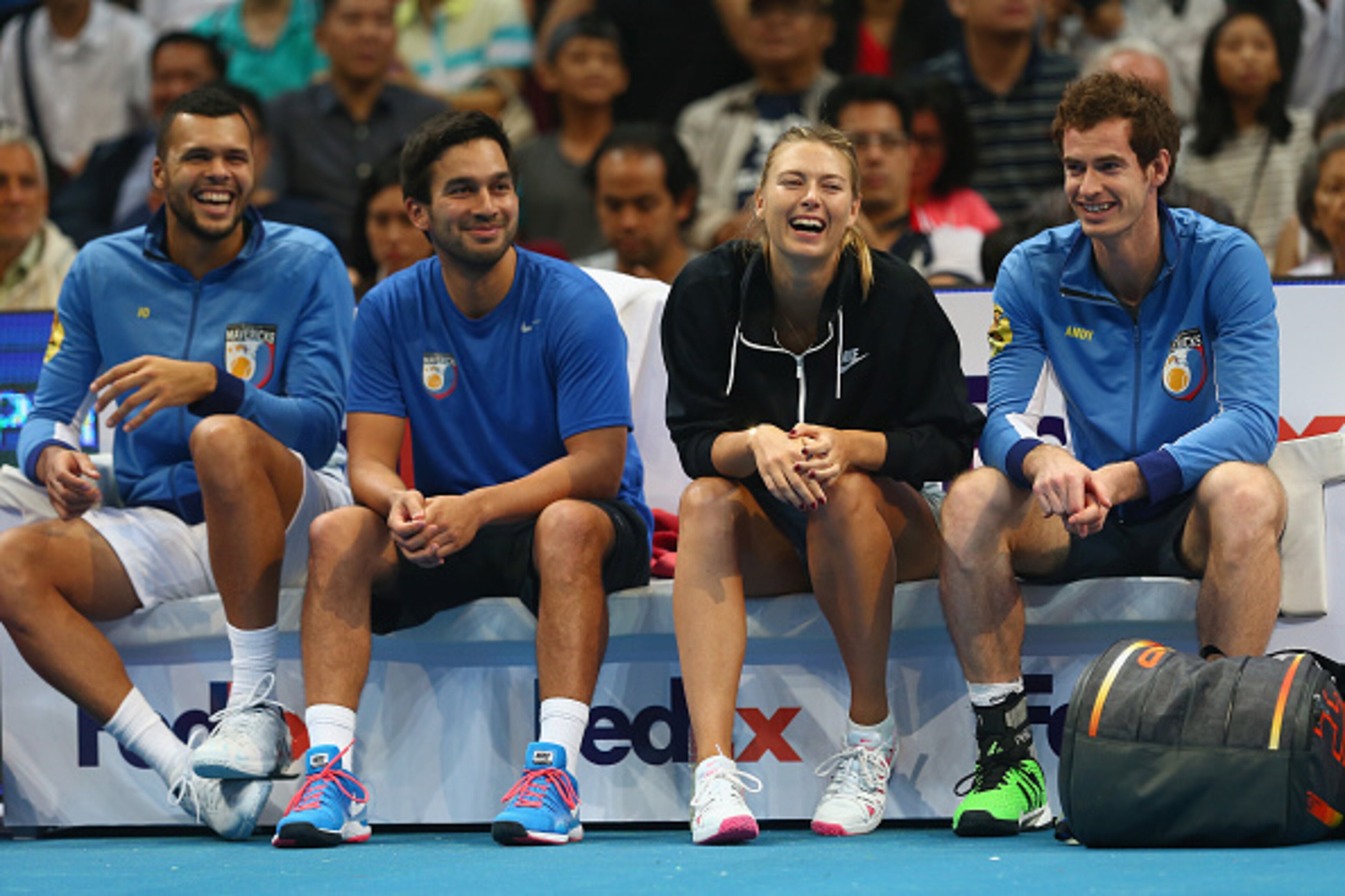 Members of the Manila Mavericks enjoy court-side laugh.