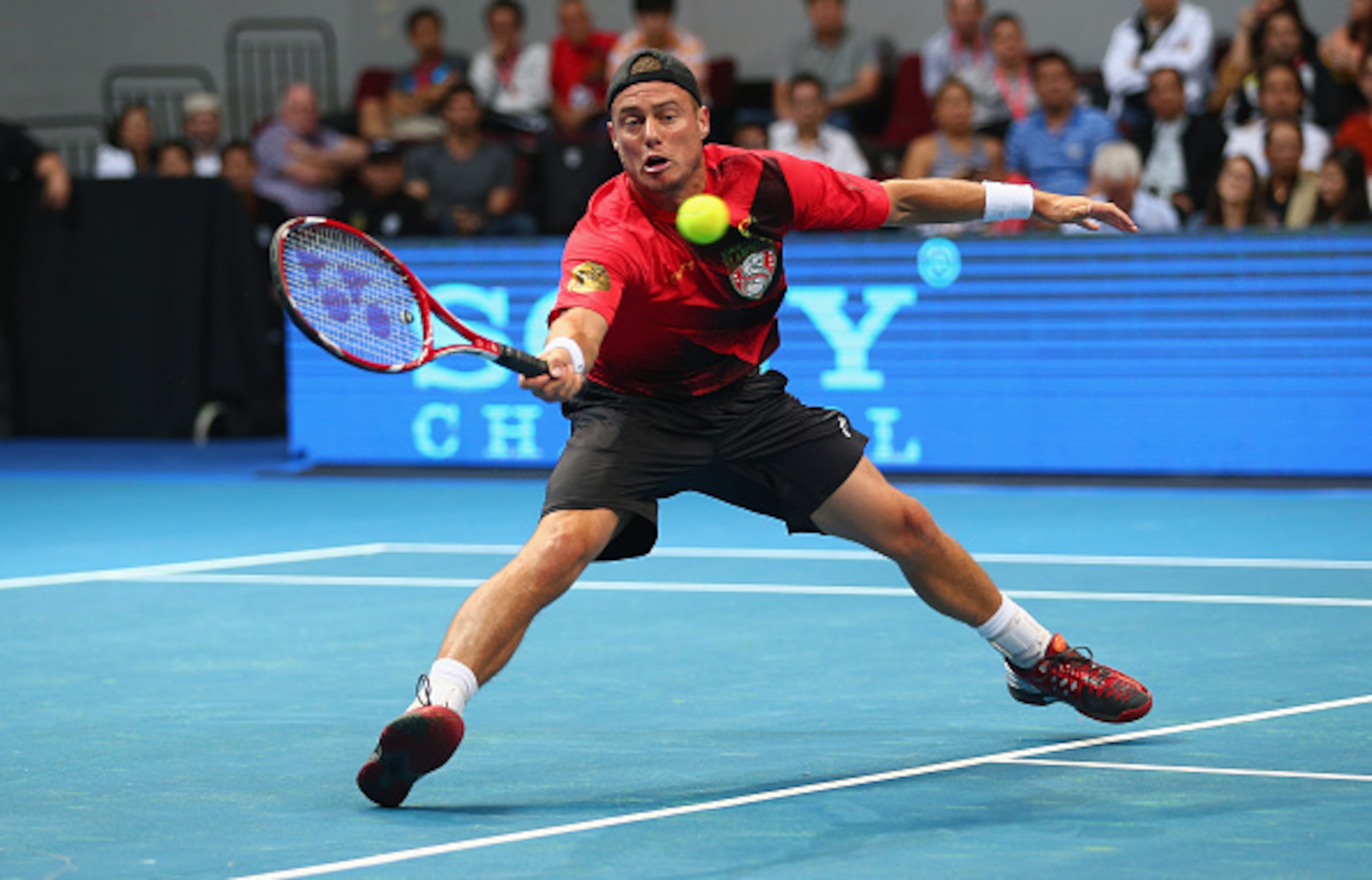 Lleyton Hewitt moves in to make a volley during an IPTL match.