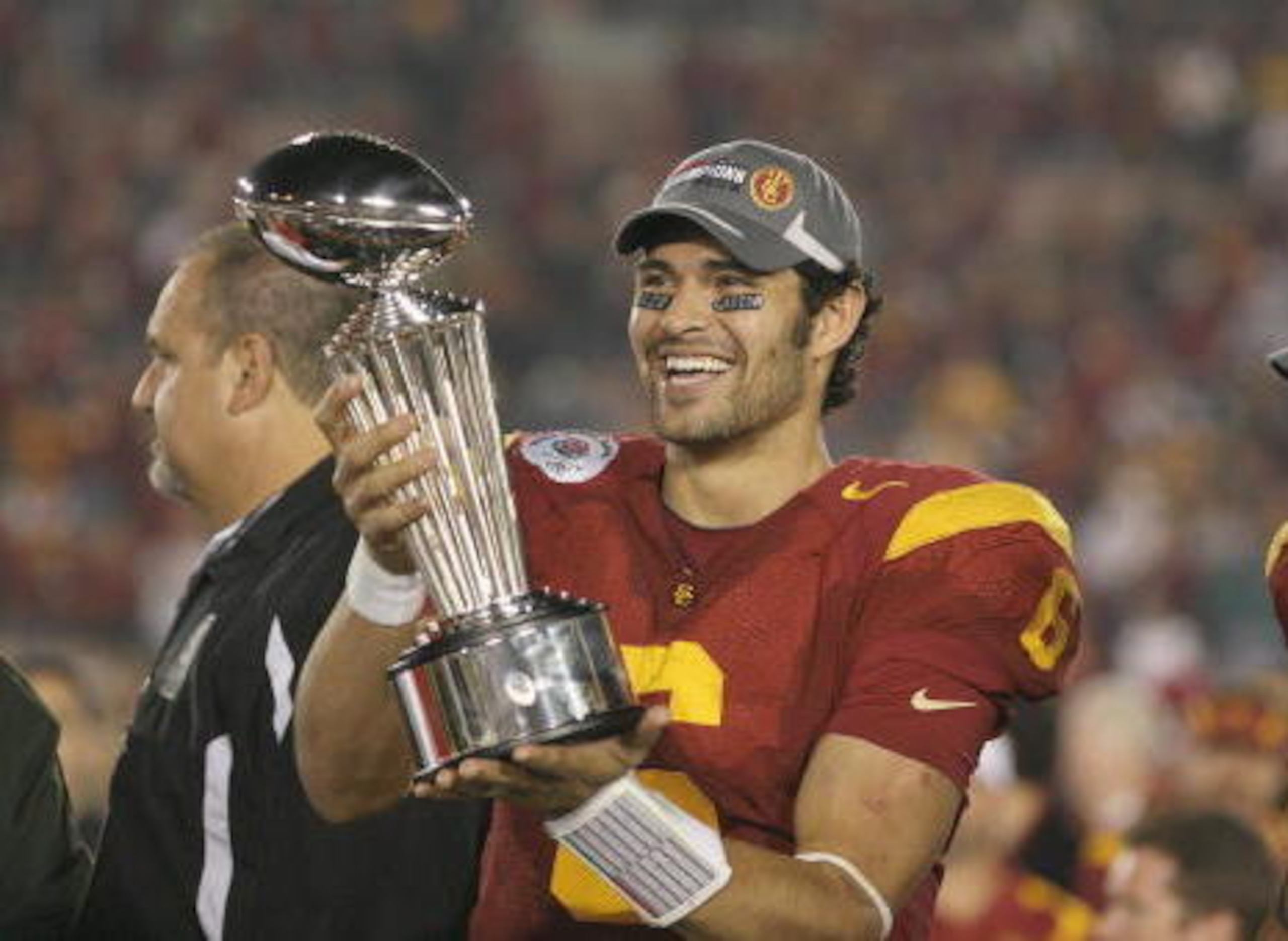 PASADENA, CA - JANUARY 1: Mark Sanchez #6 of the USC Trojans smiles as he holds the Rose Bowl Trophy after the game against the Penn State Nittany Lions on January 1, 2009 at the Rose Bowl in Pasadena, California. USC won 38-24. (Photo by Jeff Golden/G PASADENA, CA - JANUARY 1: Mark Sanchez #6 of the USC Trojans smiles as he holds the Rose Bowl Trophy after the game against the Penn State Nittany Lions on January 1, 2009 at the Rose Bowl in Pasadena, California. USC won 38-24. (Photo by Jeff Golden/G