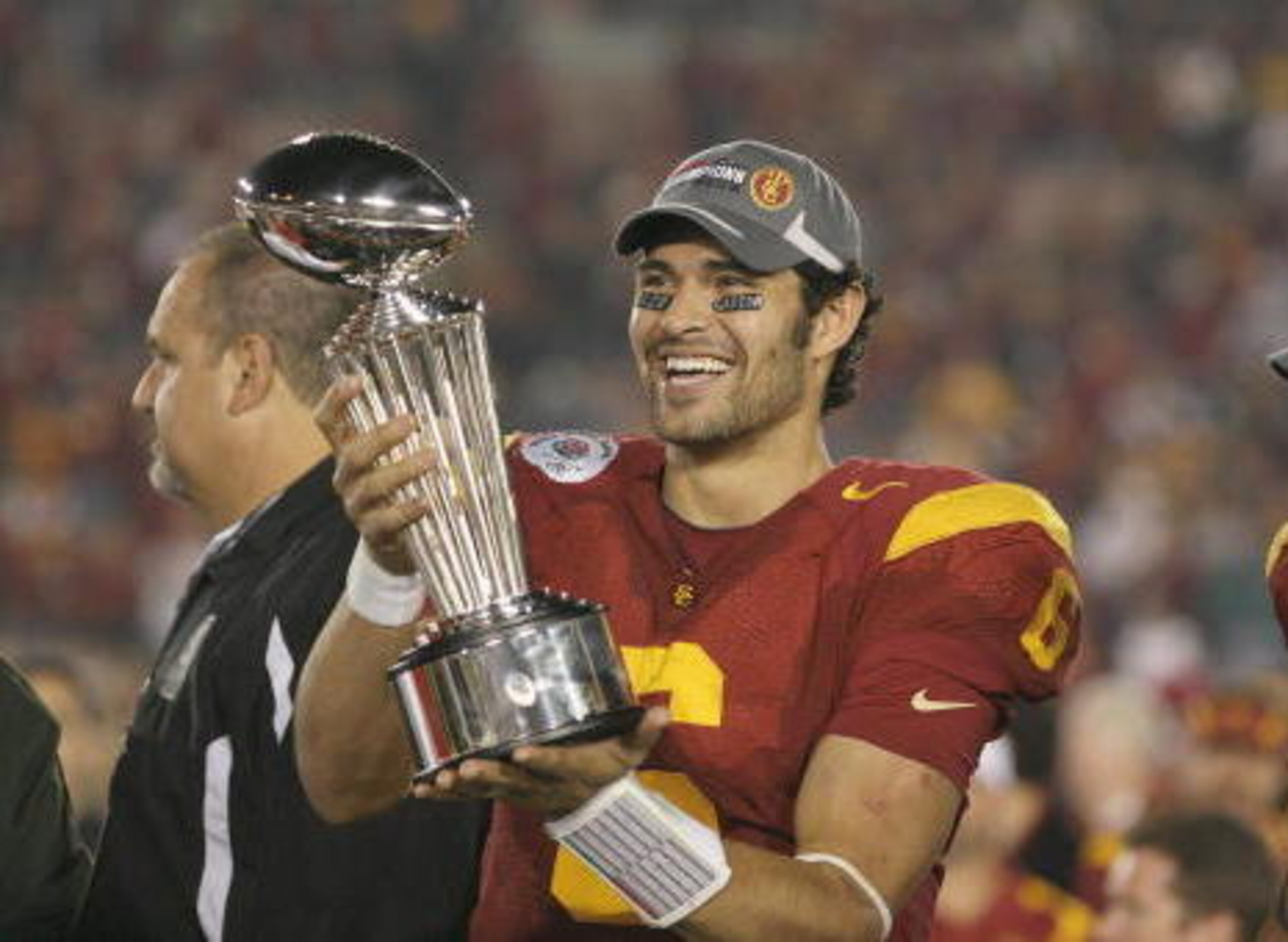 PASADENA, CA - JANUARY 1:  Mark Sanchez #6 of the USC Trojans smiles as he holds the Rose Bowl Trophy after the game against the Penn State Nittany Lions on January 1, 2009 at the Rose Bowl in Pasadena, California.  USC won 38-24.  (Photo by Jeff Golden/G