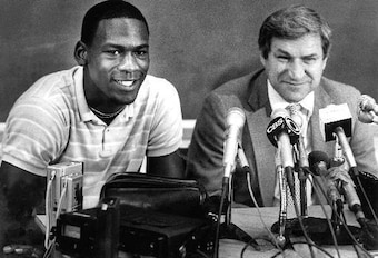 Michael Jordan (left) and coach Dean Smith Michael Jordan (left) and coach Dean Smith