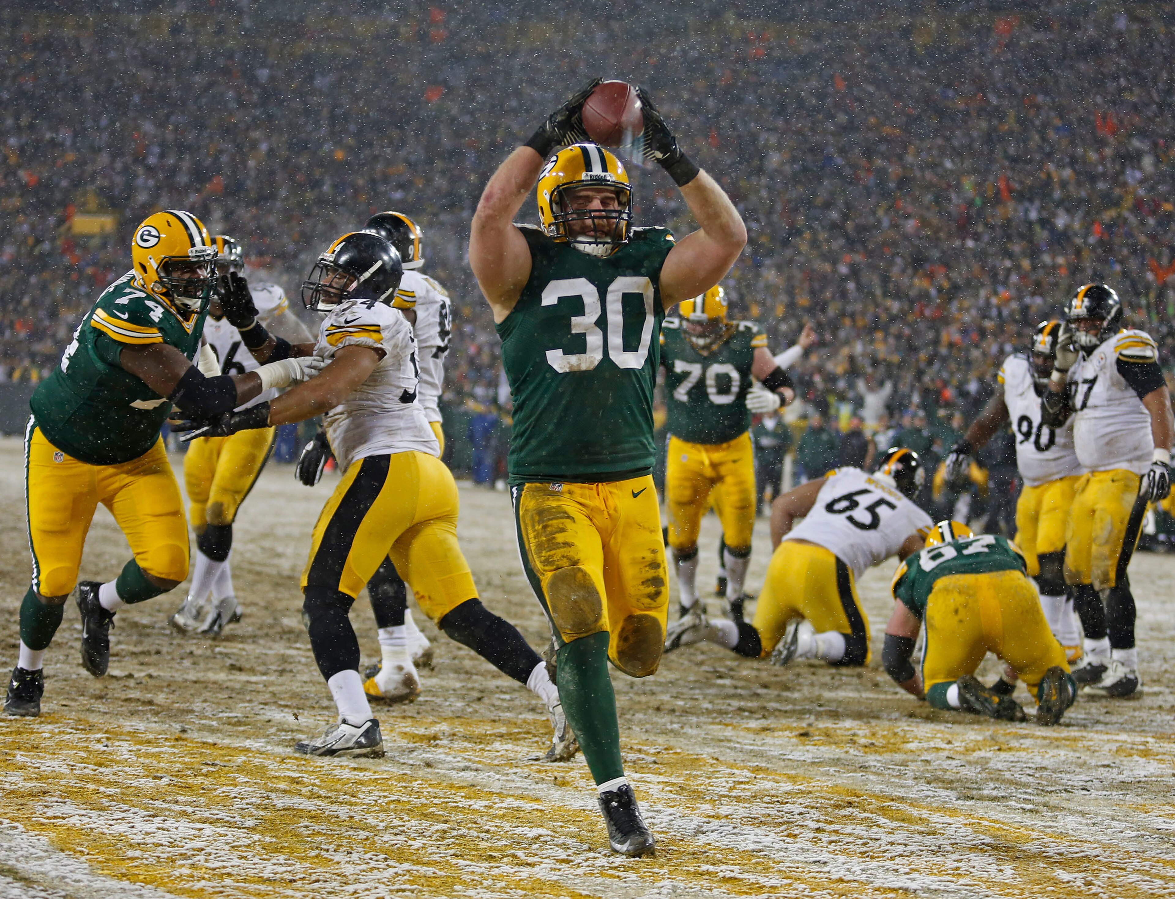 John Kuhn found the end zone in the snow.