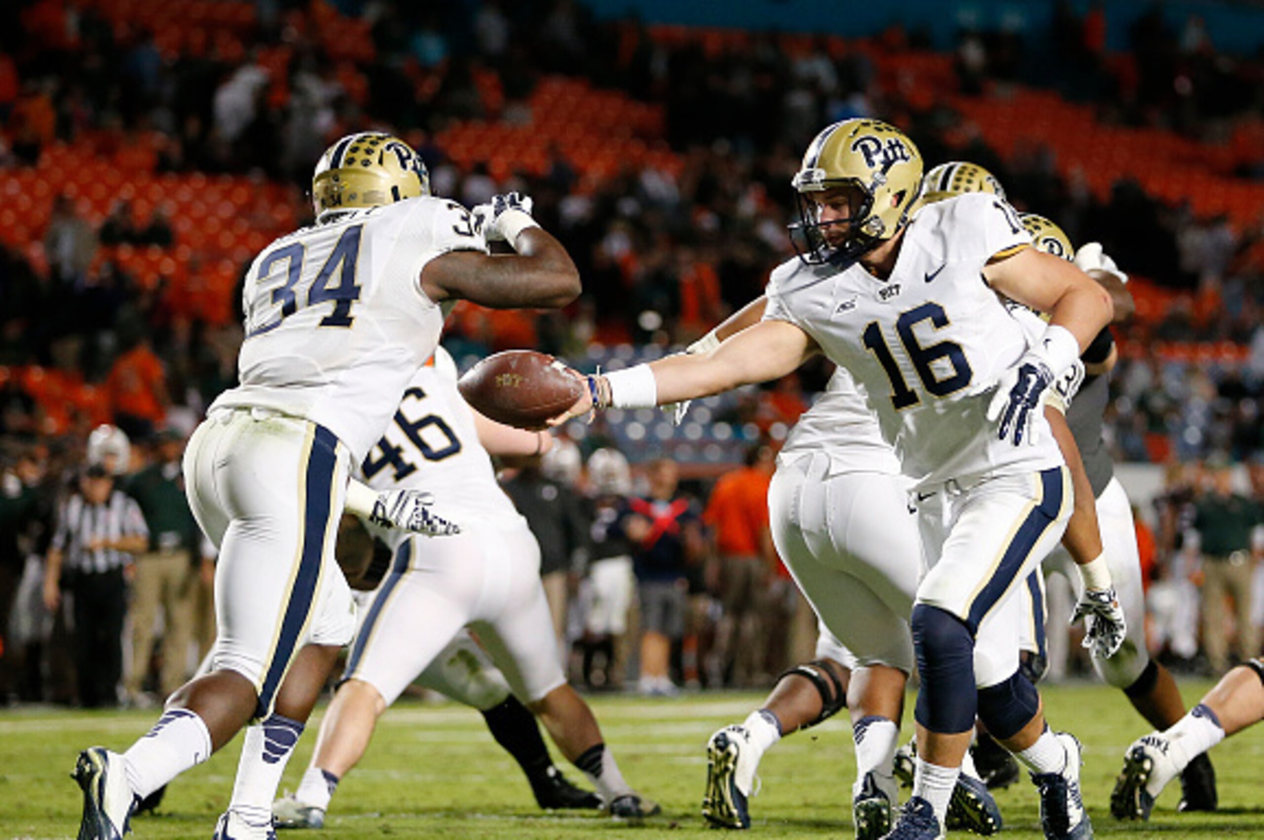 Pitt QB Chad Voytik hands off to RB Isaac Bennett