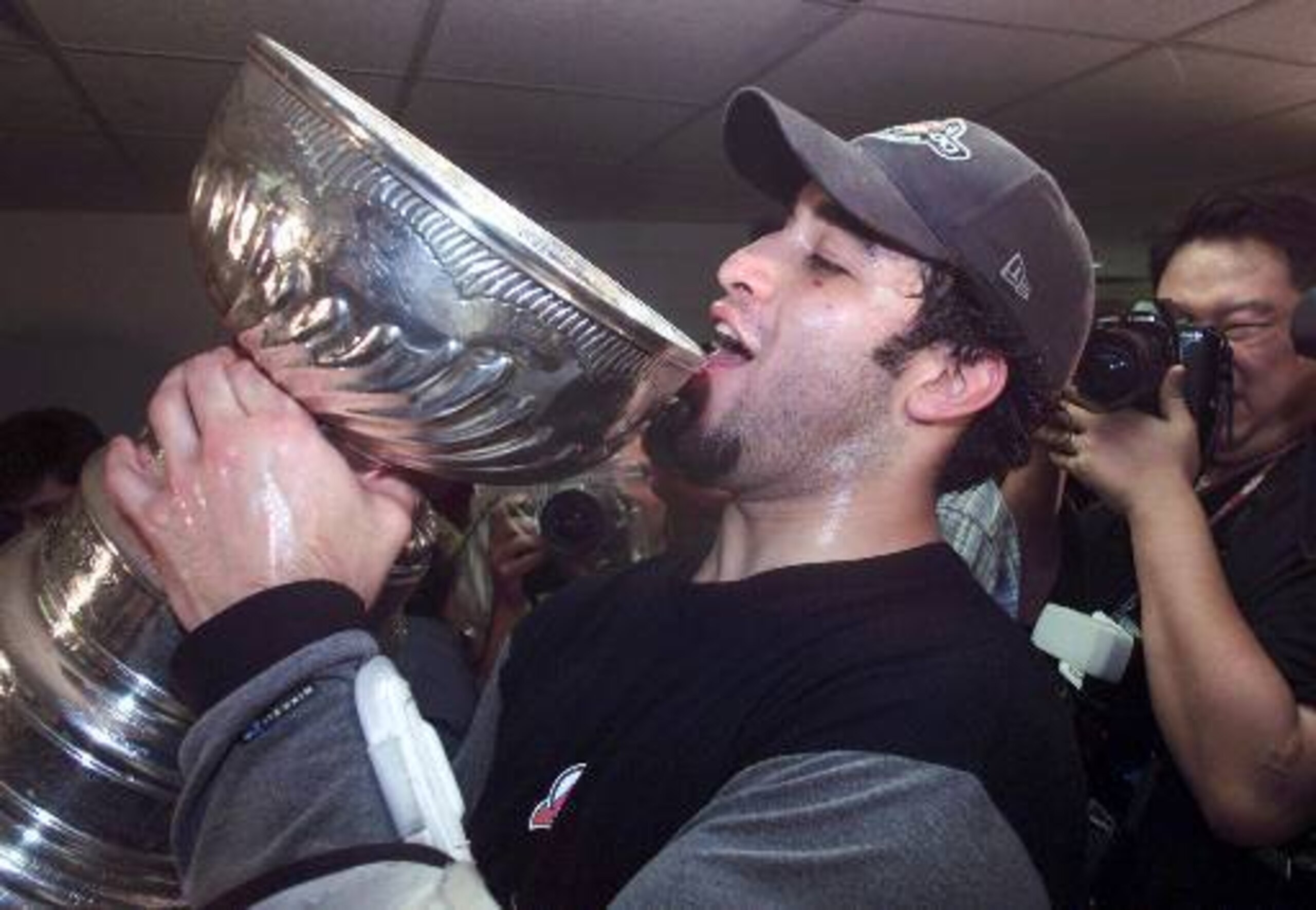 Scott Gomez, not even of legal drinking age, celebrates winning the Stanley Cup with New Jersey in 2000.