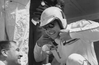 Fireball Roberts grants an interview before getting in his race car at the 24 Hours of Le Mans in 1962.