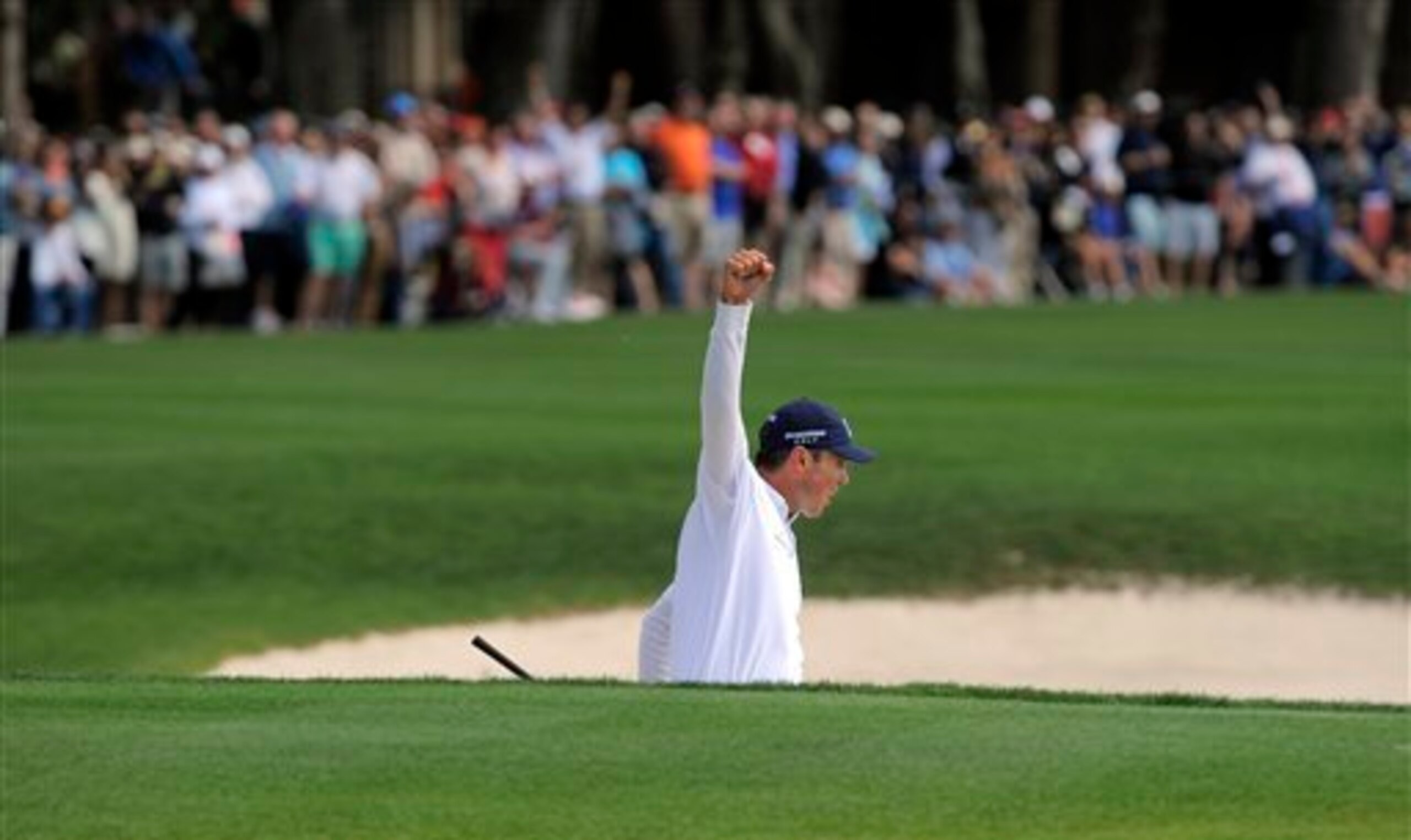 Matt Kuchar reacts to holing a bunker shot on the 72nd hole at Harbour Town.