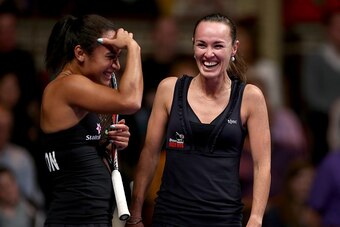 LONDON, ENGLAND - DECEMBER 07:  Heather Watson (L) and Martina Hingis (R) laugh during their match in the Mylan WTT Smash Hits on day five of the Statoil Masters Tennis at the Royal Albert Hall on December 7, 2014 in London, England.  (Photo by Jordan Man
