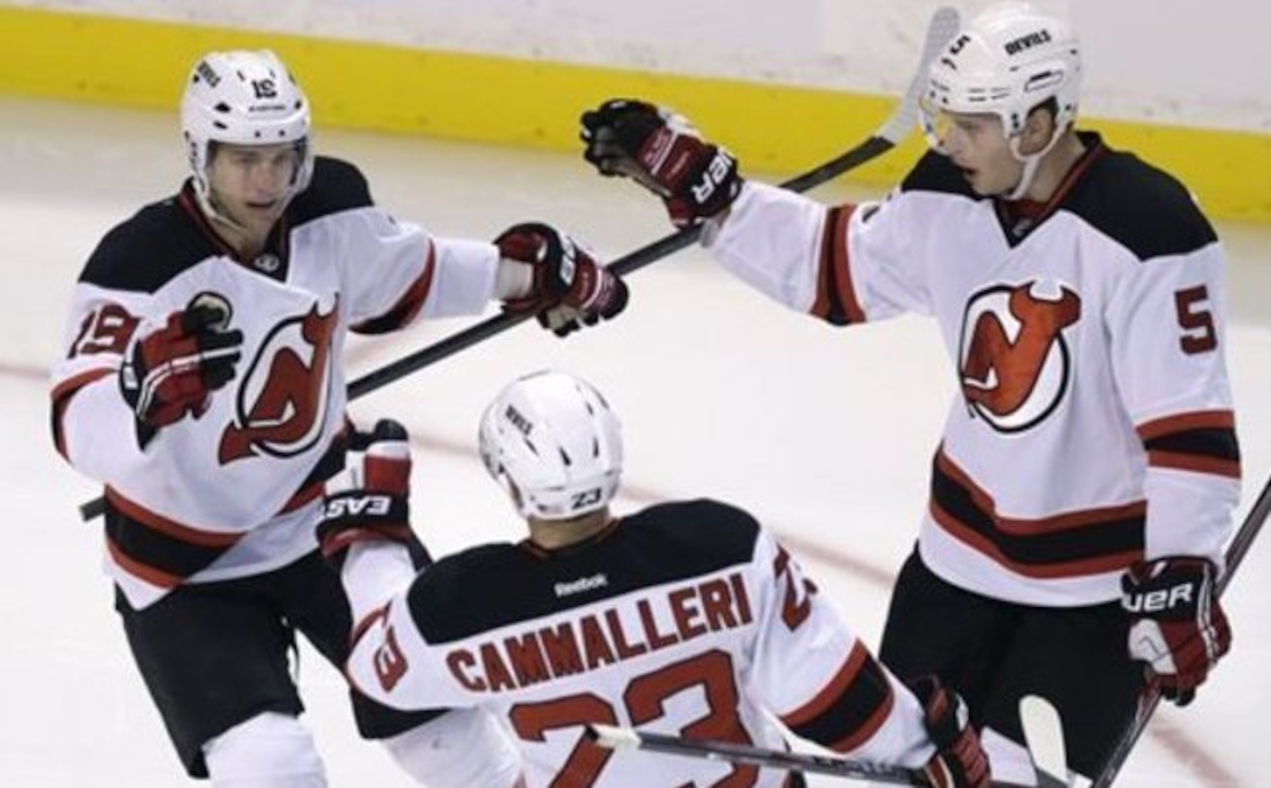 Adam Larsson celebrates a goal with Travis Zajac and Michael Cammalleri.