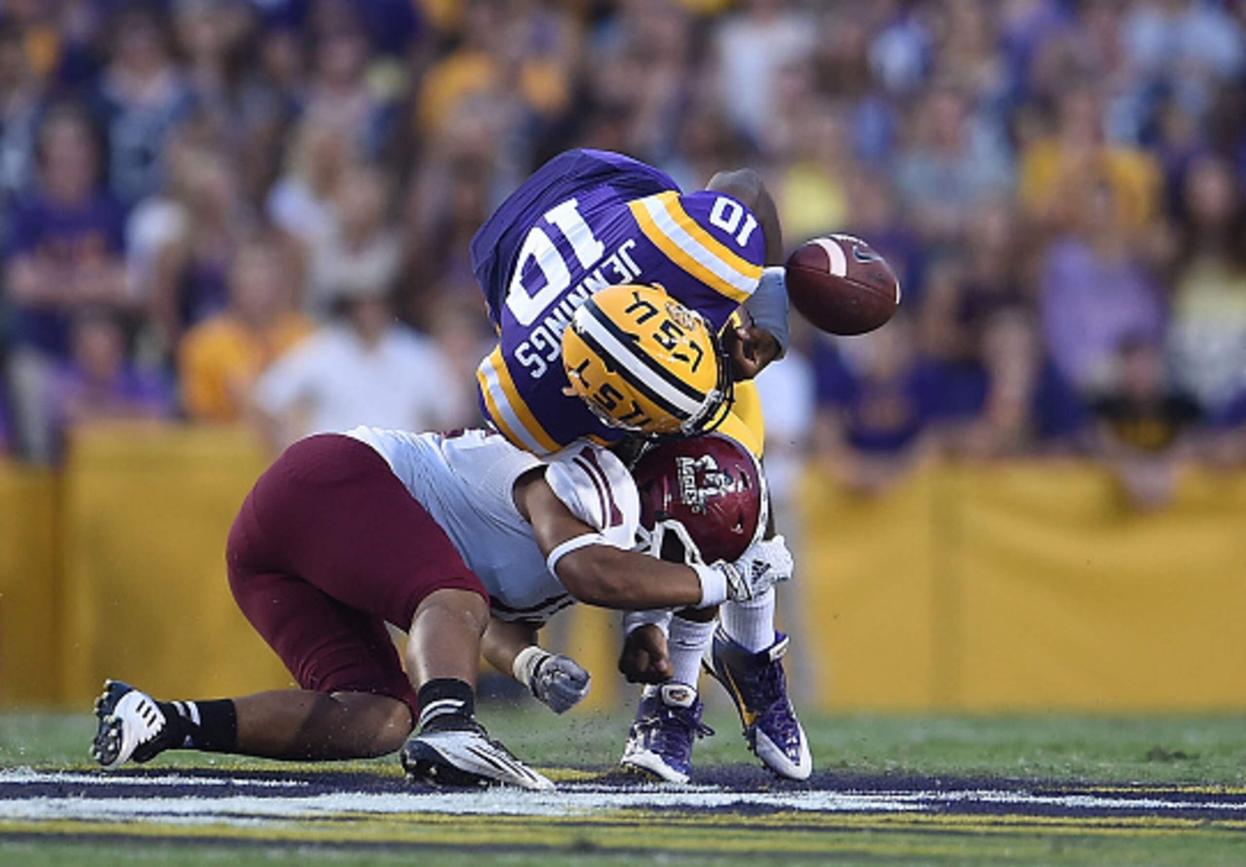 Quarterback Anthony Jennings (No. 10) fumbles against New Mexico State.