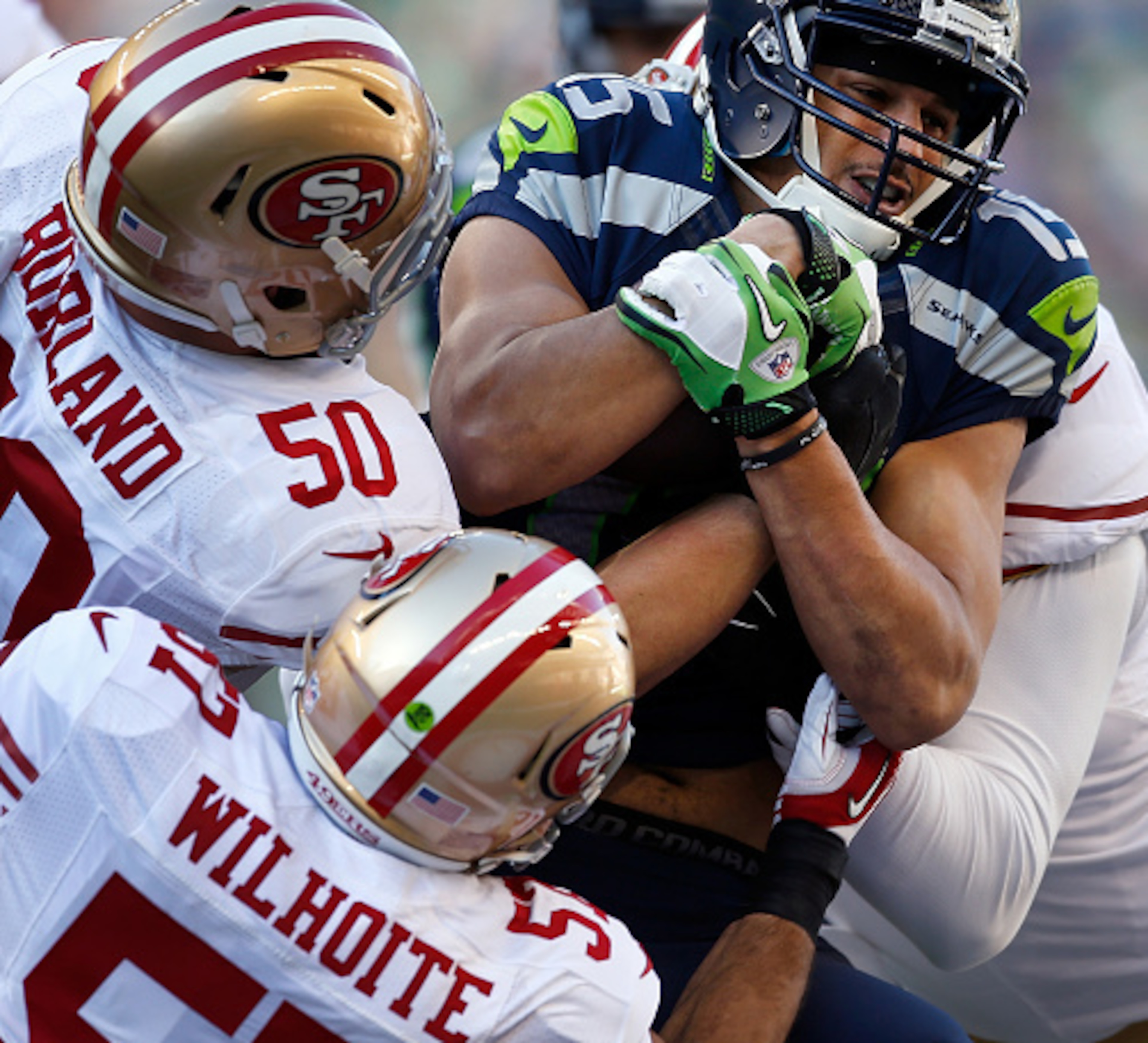 Linebackers Michael Wilhoite and Chris Borland could not thwart the vaunted Seahawks running game.