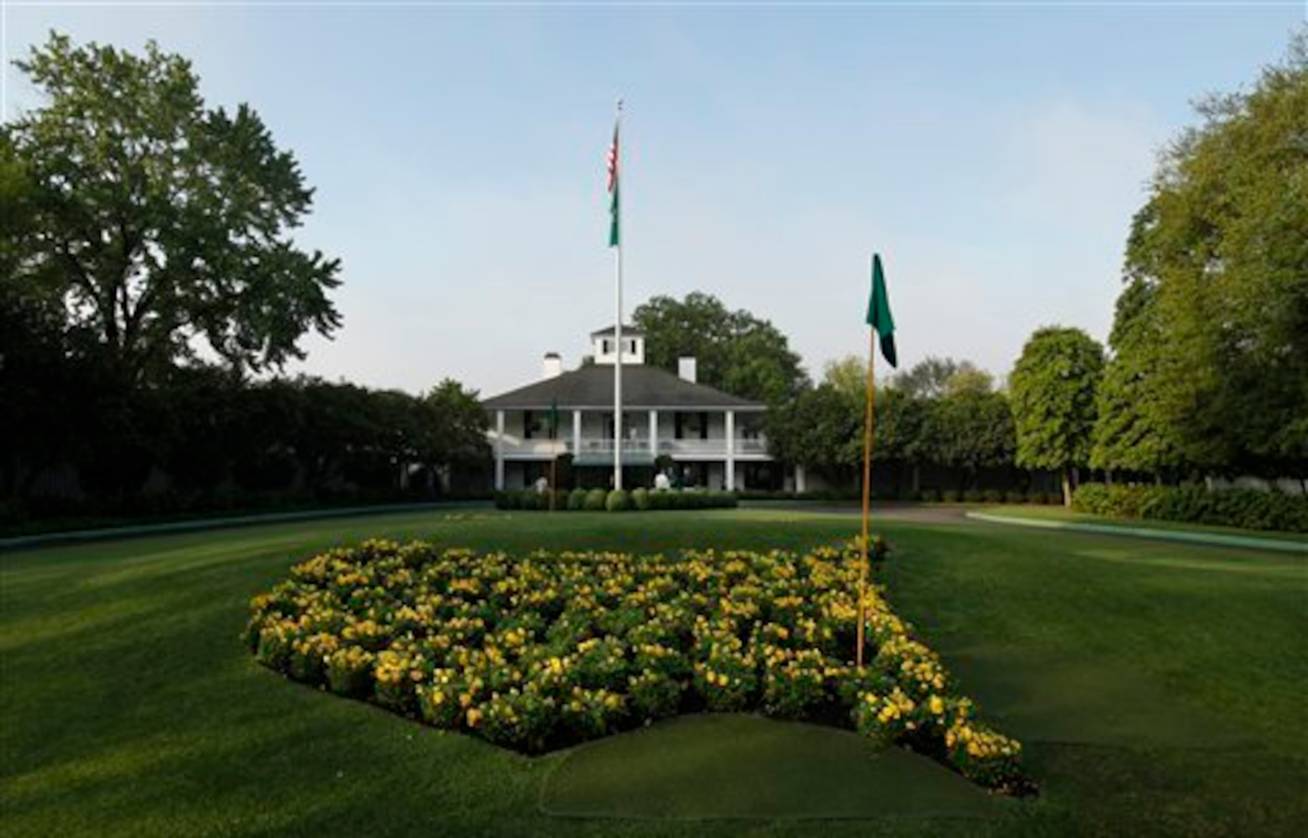 At the end of Magnolia Lane are the flowers grown in the shape of the United States and the historic clubhouse.
