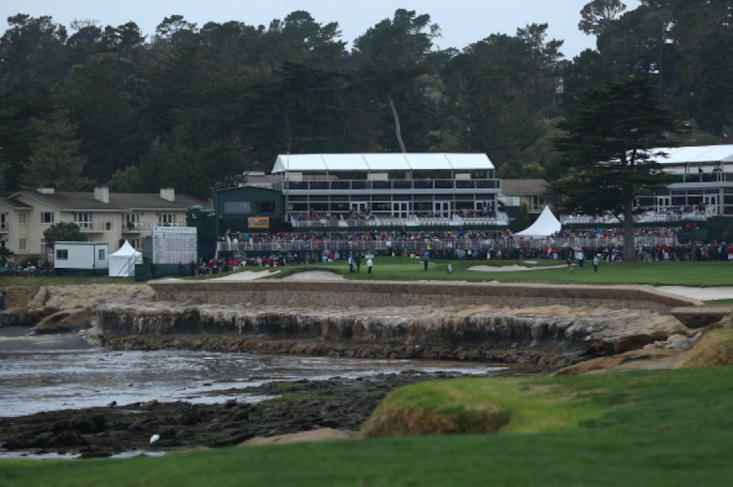 The 18th hole at Pebble Beach Golf Links winds around Carmel Bay.