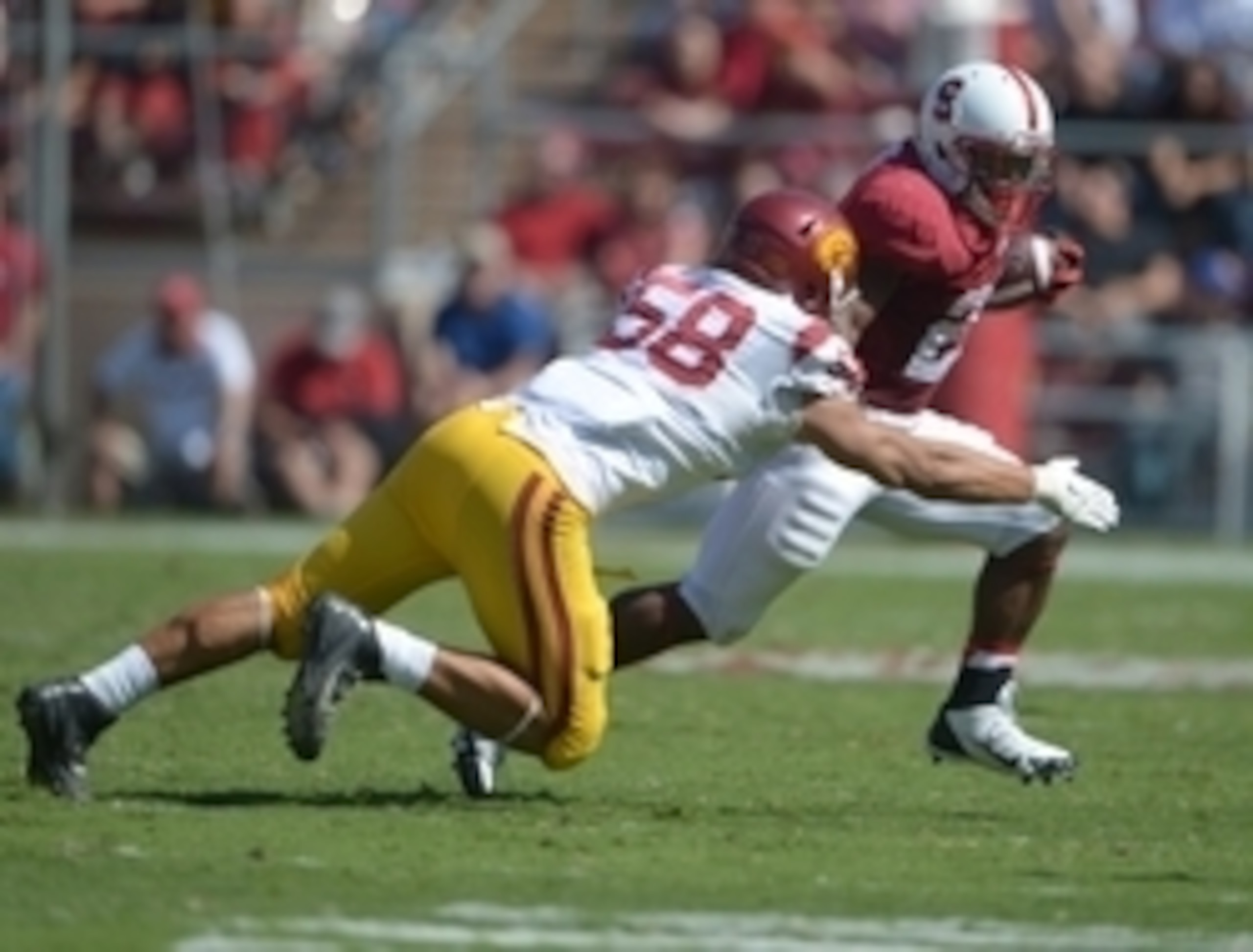 LB J.R. Tavai chases QB Kevin Hogan