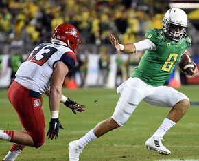 LB Scooby Wright couldn't best Mariota in their second meeting of 2014