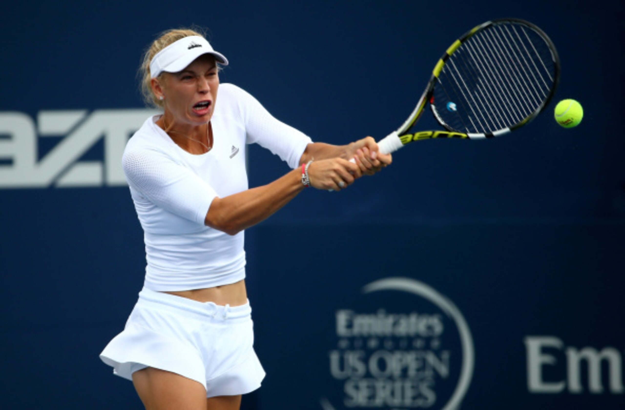 Caroline Wozniacki hits a backhand at the 2014 Rogers Cup in Montreal.