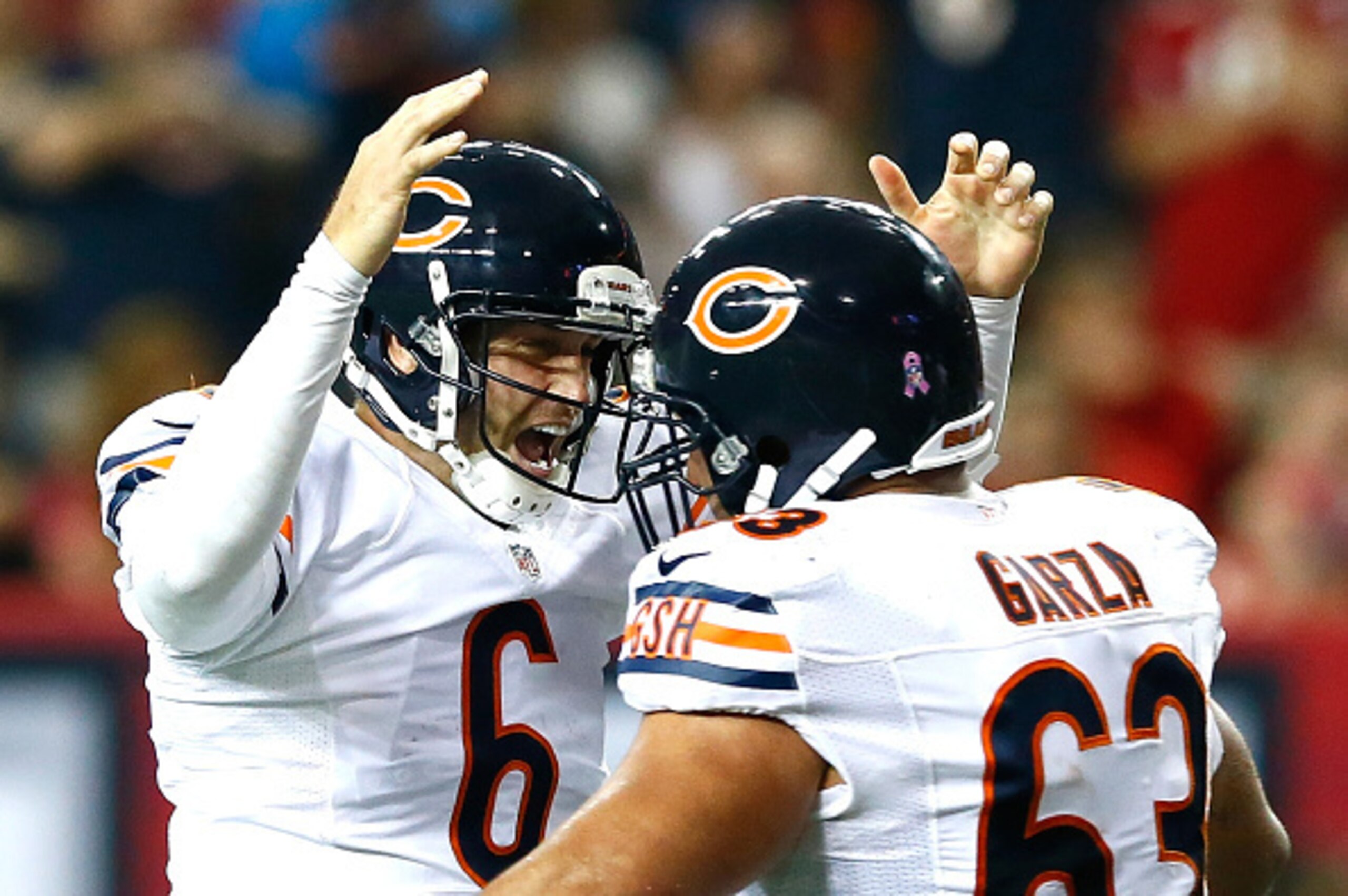 ATLANTA, GA - OCTOBER 12: Jay Cutler #6 of the Chicago Bears reacts after a touchdown by Matt Forte #22 (not pictured) against the Atlanta Falcons with Roberto Garza #63 at Georgia Dome on October 12, 2014 in Atlanta, Georgia. (Photo by Kevin C. Cox/Get ATLANTA, GA - OCTOBER 12: Jay Cutler #6 of the Chicago Bears reacts after a touchdown by Matt Forte #22 (not pictured) against the Atlanta Falcons with Roberto Garza #63 at Georgia Dome on October 12, 2014 in Atlanta, Georgia. (Photo by Kevin C. Cox/Get