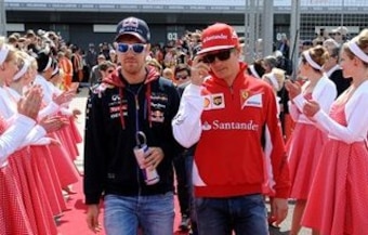 Sebastian Vettel and Kimi Raikkonen at the 2014 British Grand Prix.
