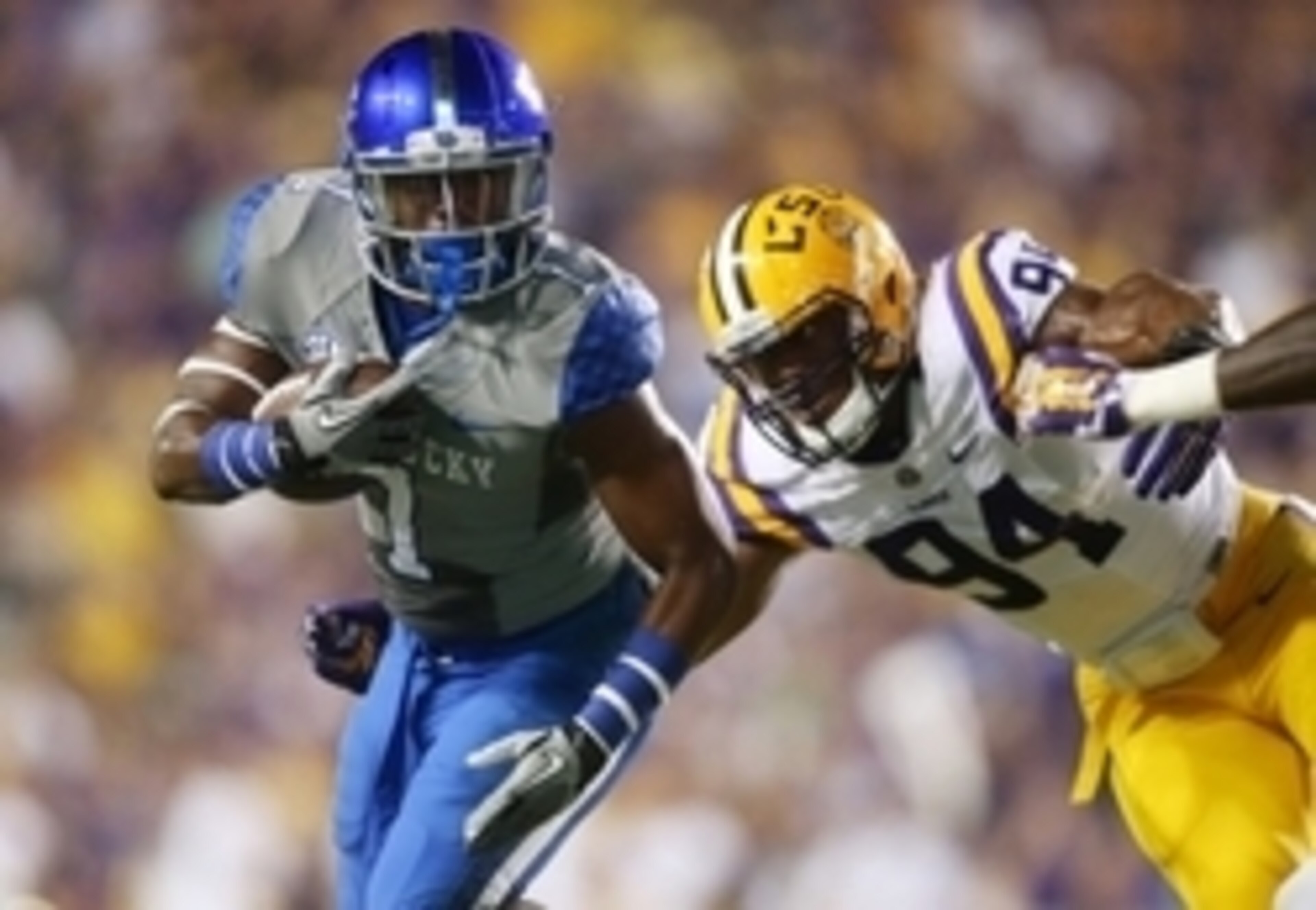 LSU junior defensive end Danielle Hunter (No. 94) attempts to tackle against Kentucky receiver Ryan Timmons (No. 1).