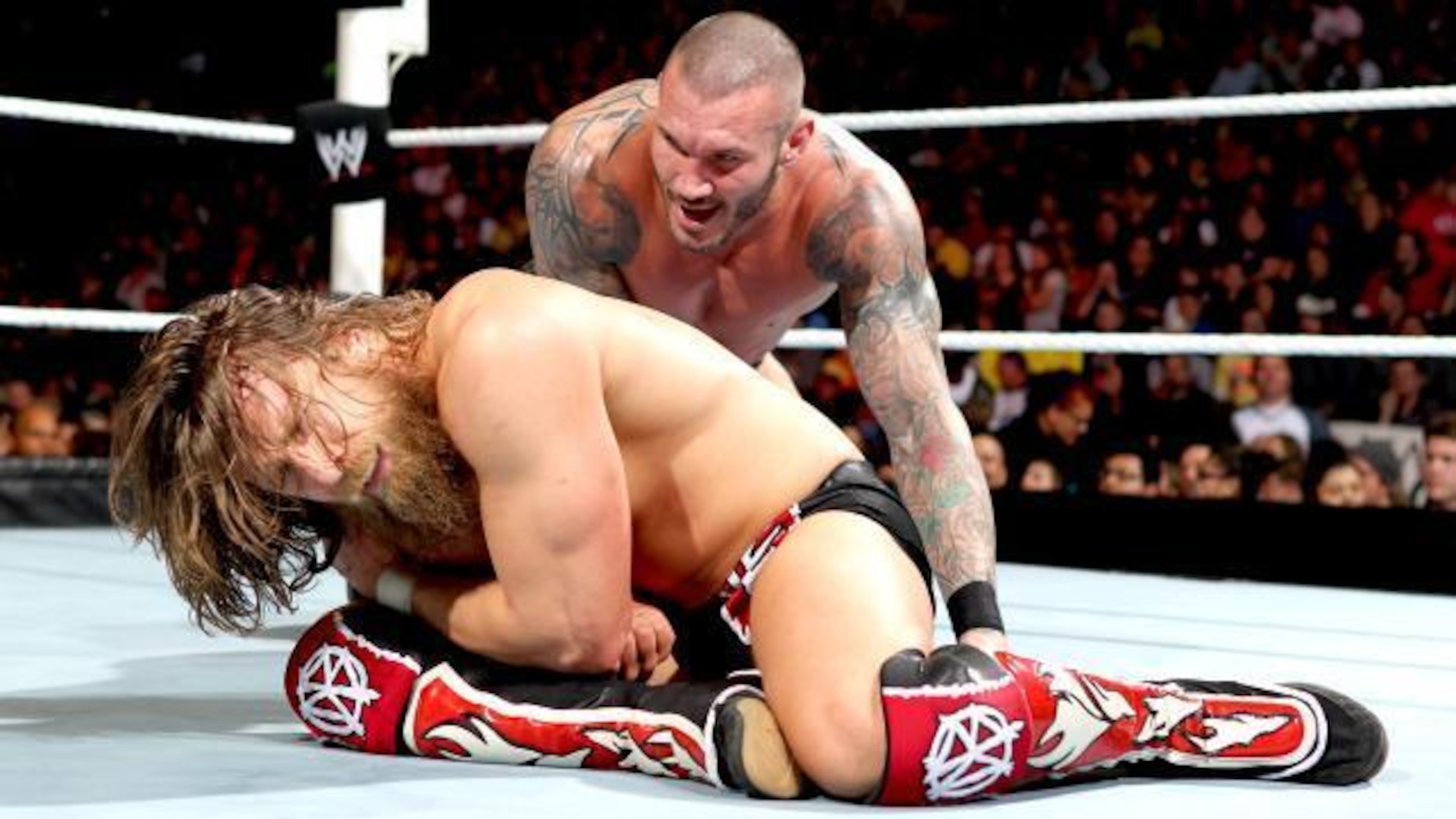 Randy Orton stalks his opponent, Daniel Bryan. Randy Orton stalks his opponent, Daniel Bryan.