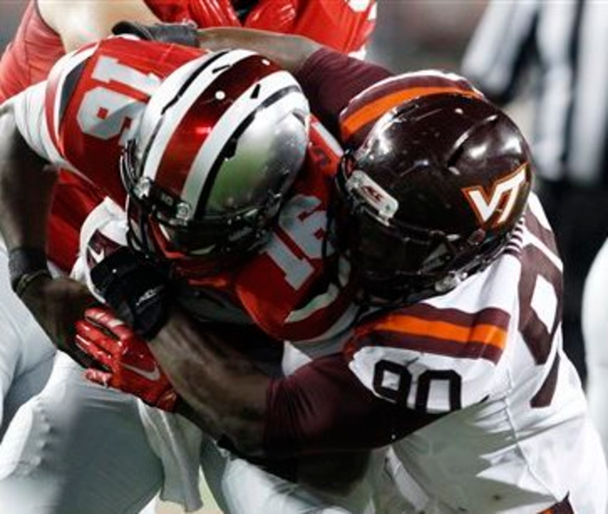 Virginia Tech defensive end Dadi Nicolas bringing down JT Barrett of Ohio State