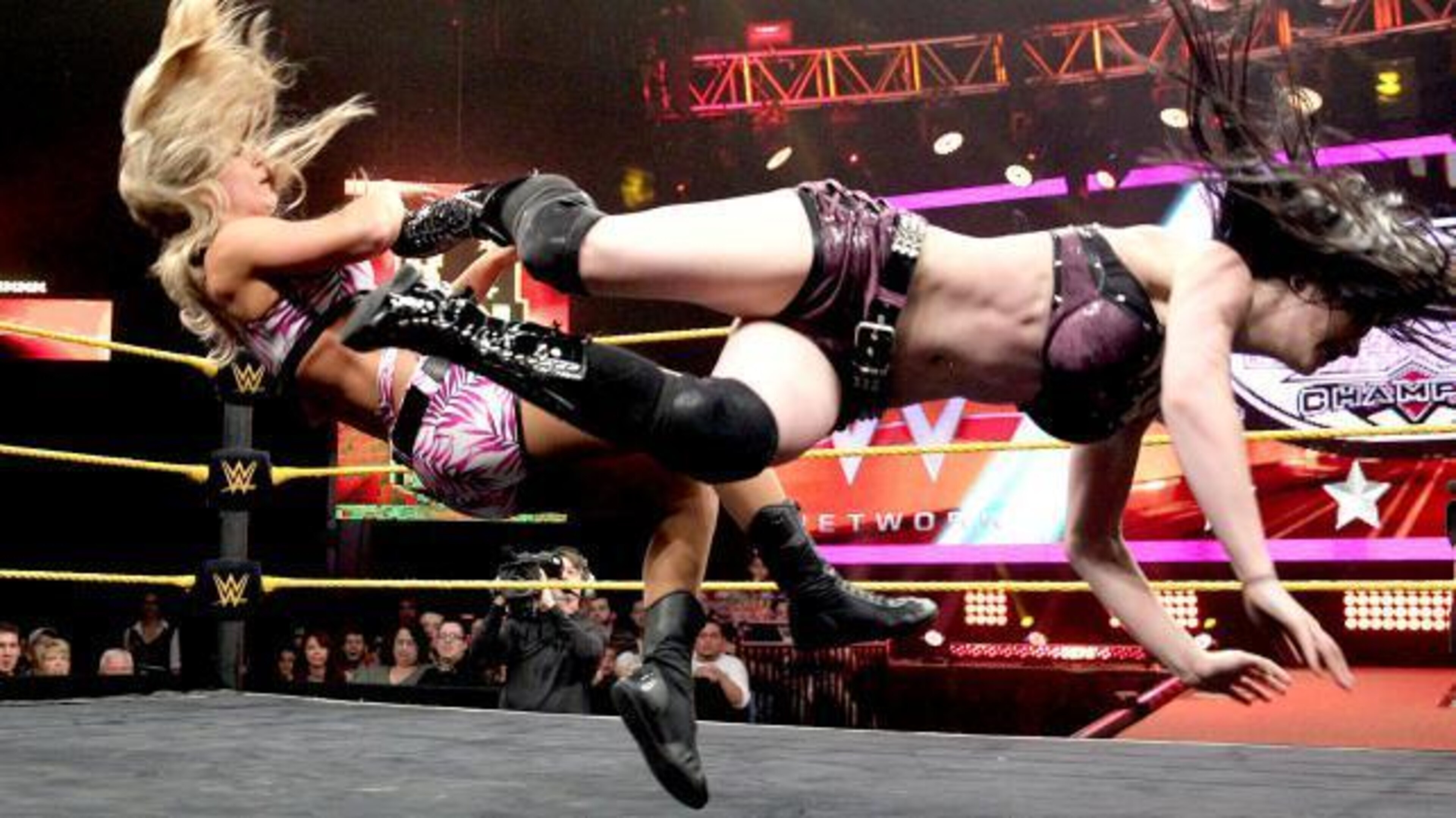 Paige lands a devastating dropkick on Emma. Paige lands a devastating dropkick on Emma.