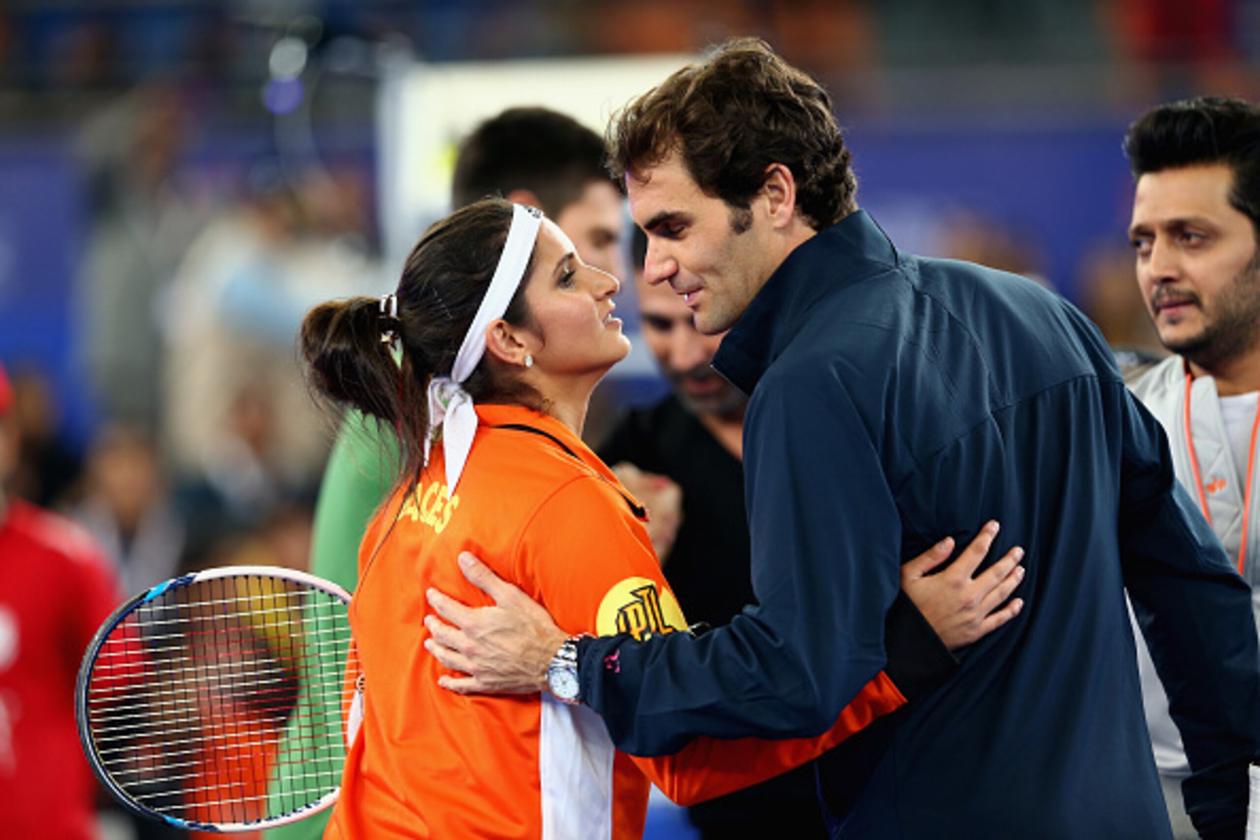 Sania Mirza and Roger Federer, teammates for the Indian Aces, greet each other during a 2014 IPTL match.