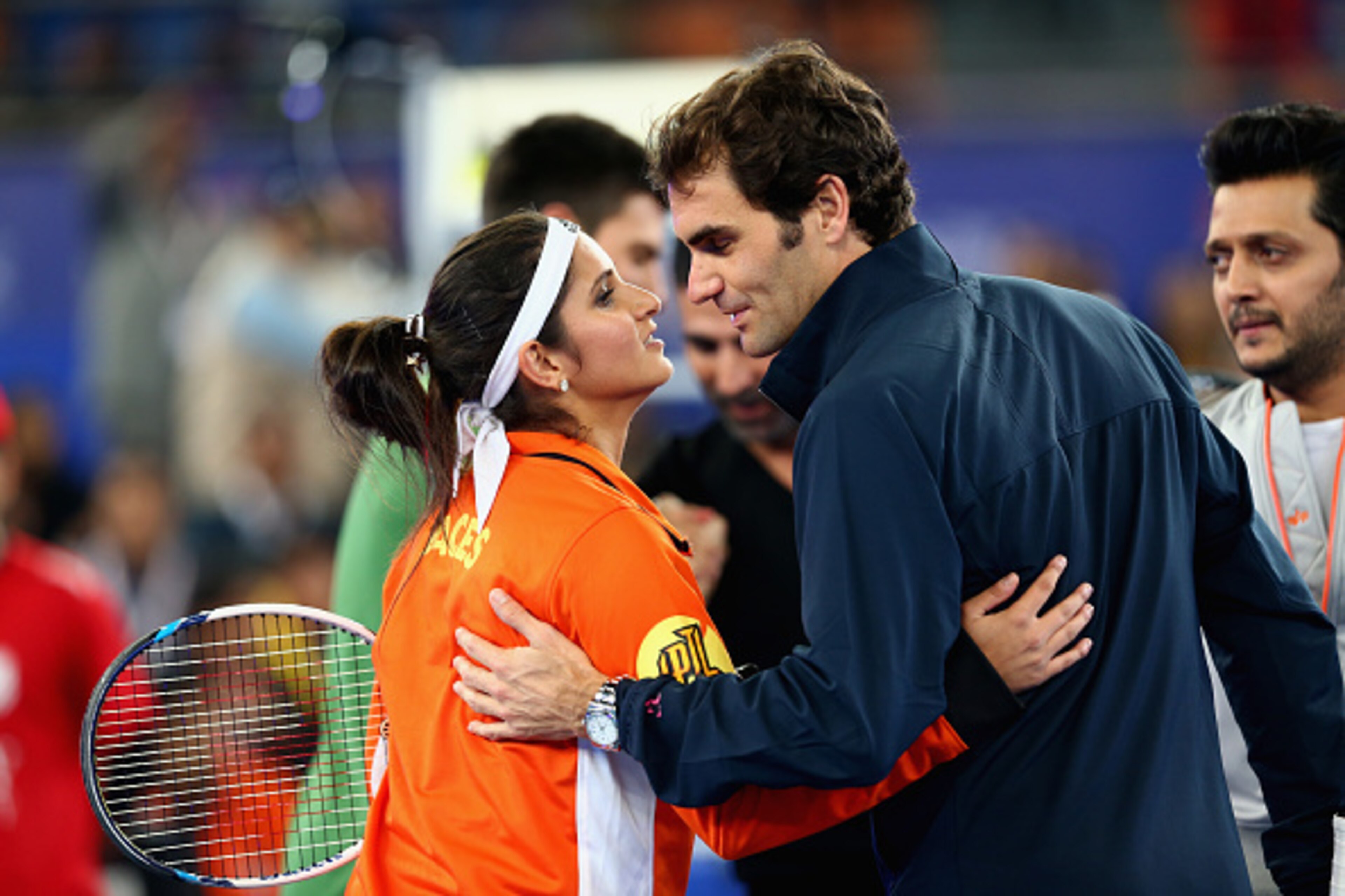 Sania Mirza and Roger Federer, teammates for the Indian Aces, greet each other during a 2014 IPTL match.