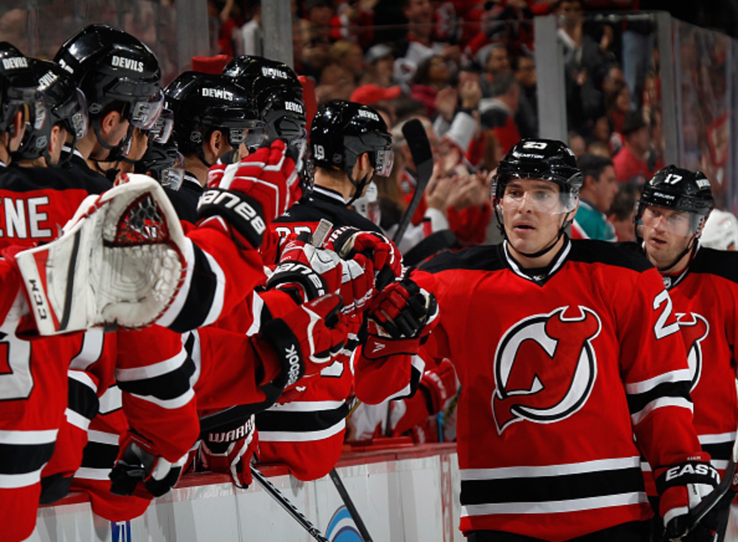 Michael Cammalleri celebrates scoring a goal with teammates on the bench. Michael Cammalleri celebrates scoring a goal with teammates on the bench.