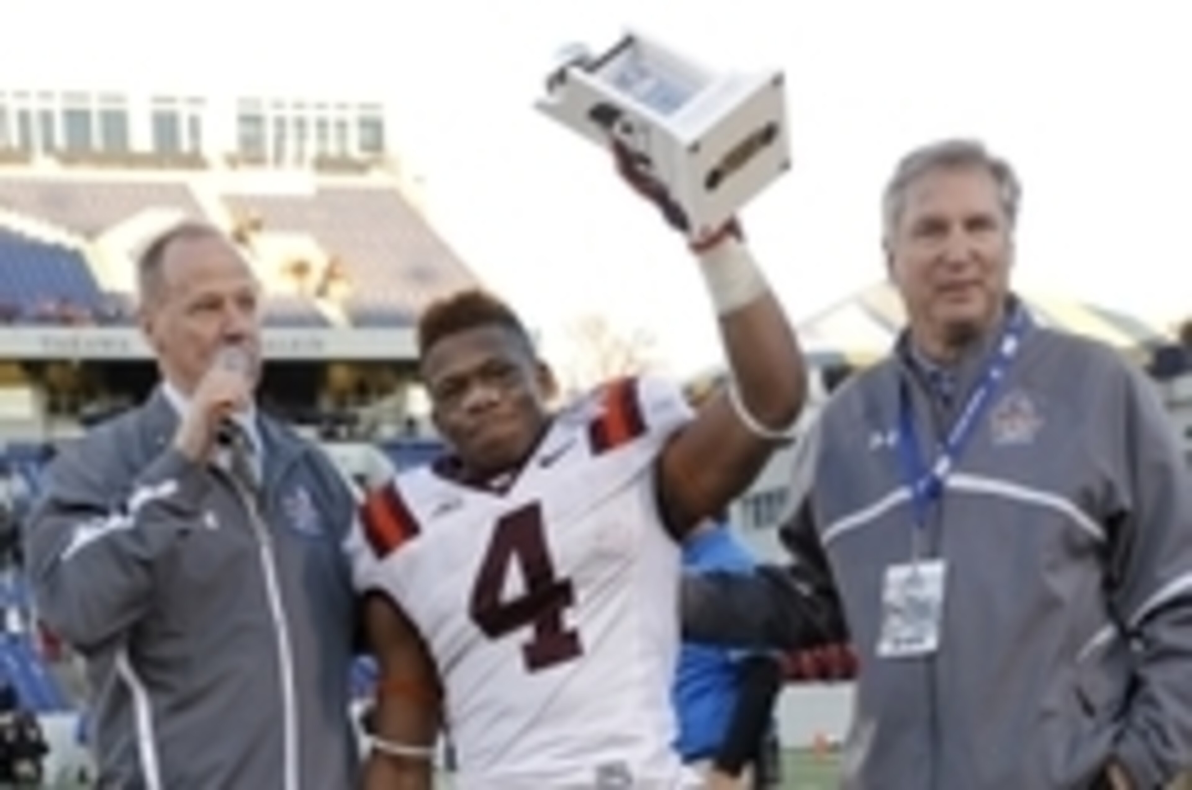 Hokies running back J.C. Coleman celebrating being named Military Bowl MVP Hokies running back J.C. Coleman celebrating being named Military Bowl MVP